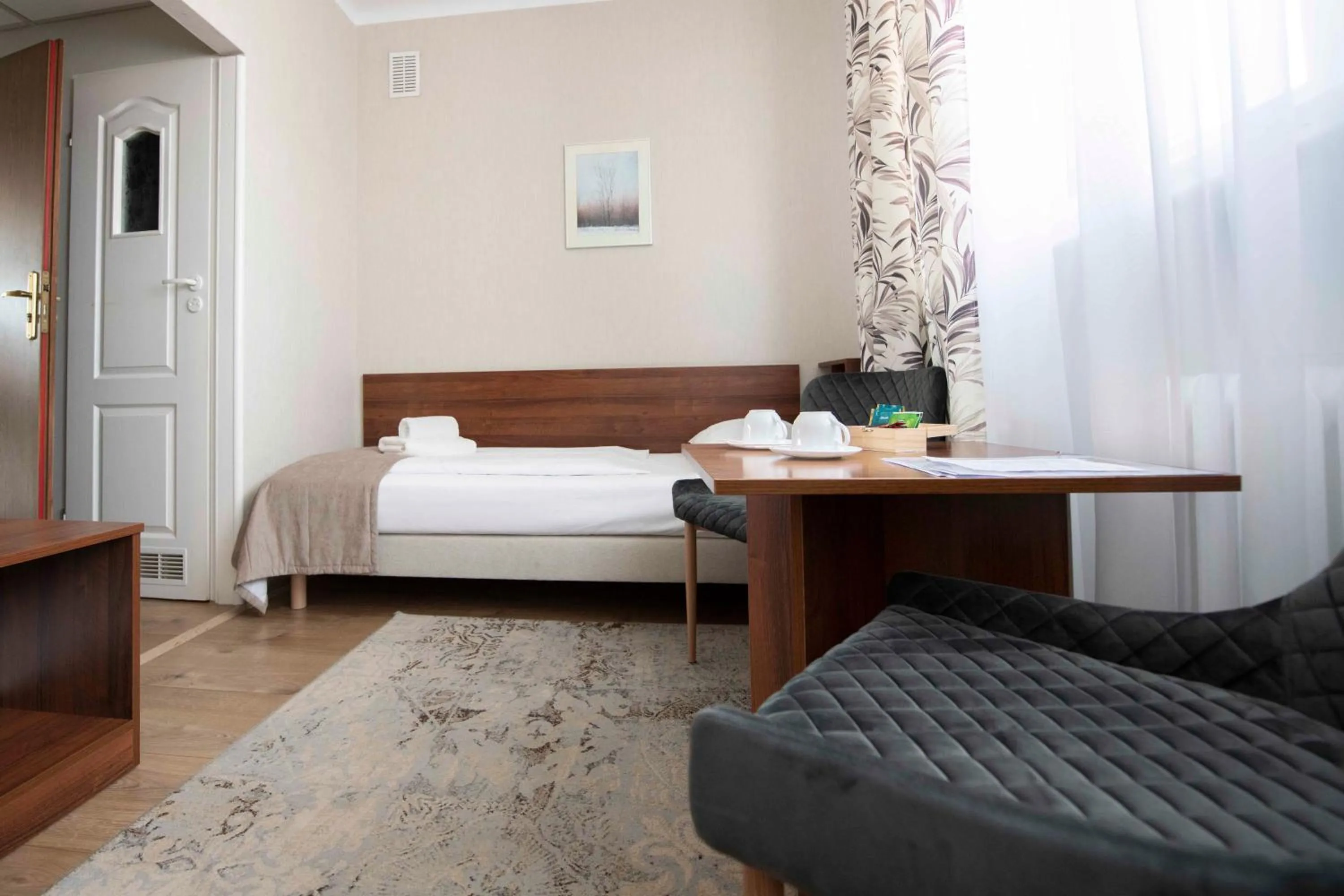 Seating area, Bed in Hotel Polonia