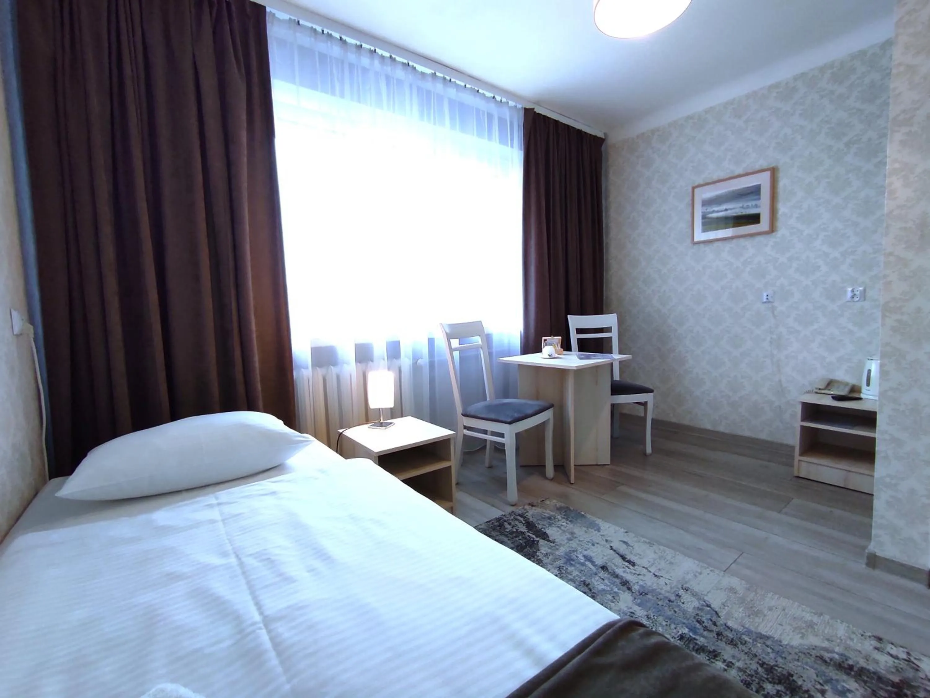 Seating area, Bed in Hotel Polonia