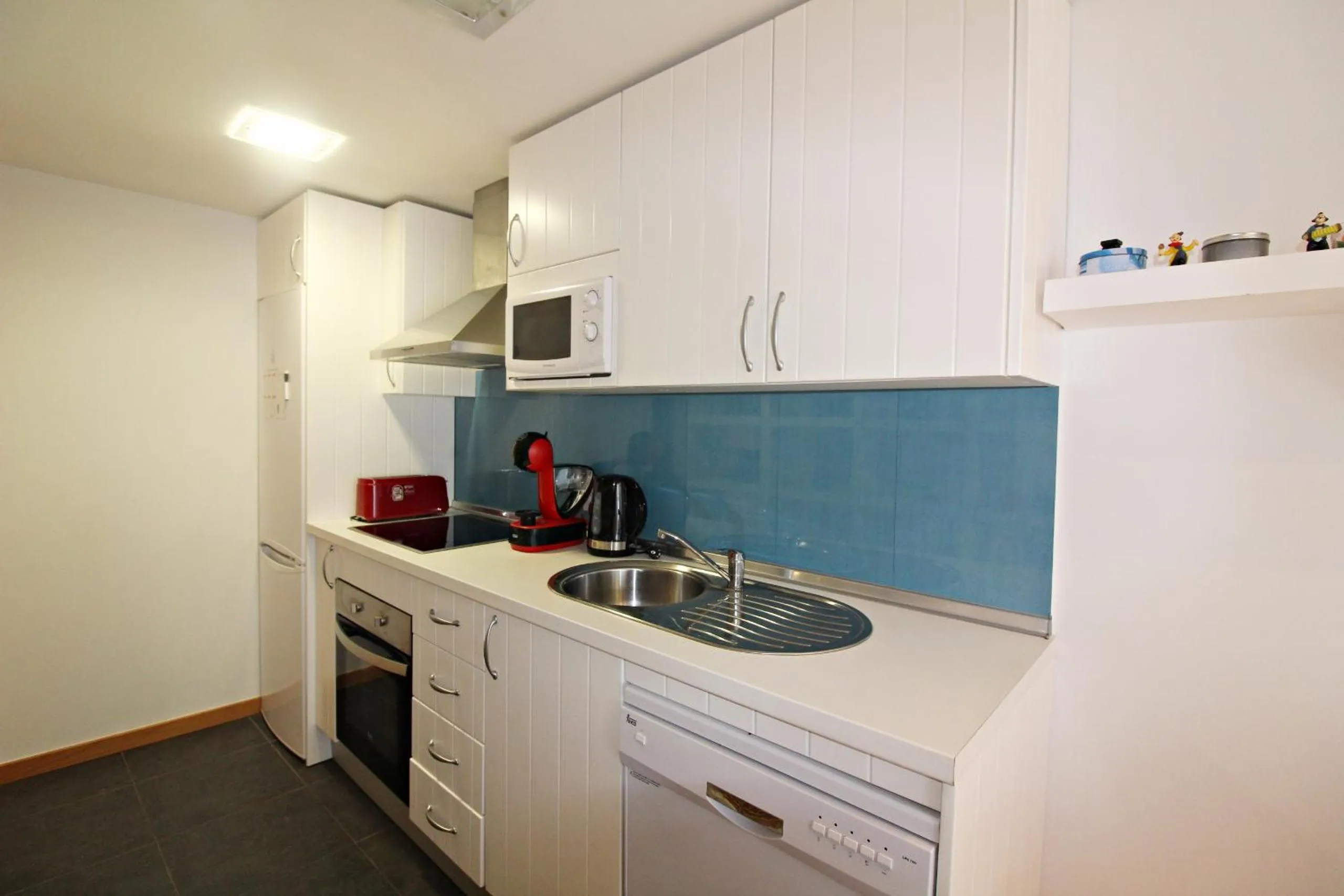 Kitchen or kitchenette in Apartamentos Alborada III