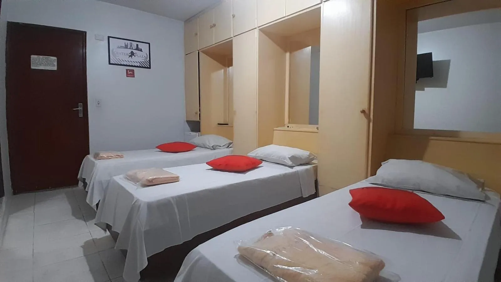 Bed in Center Plaza Hotel