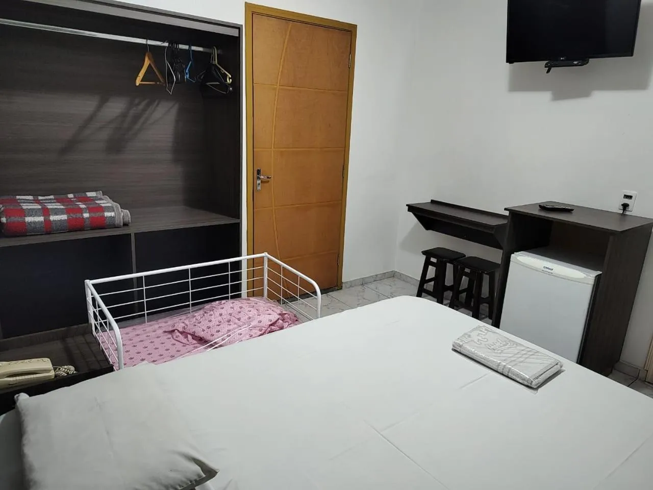 Bed in Center Plaza Hotel