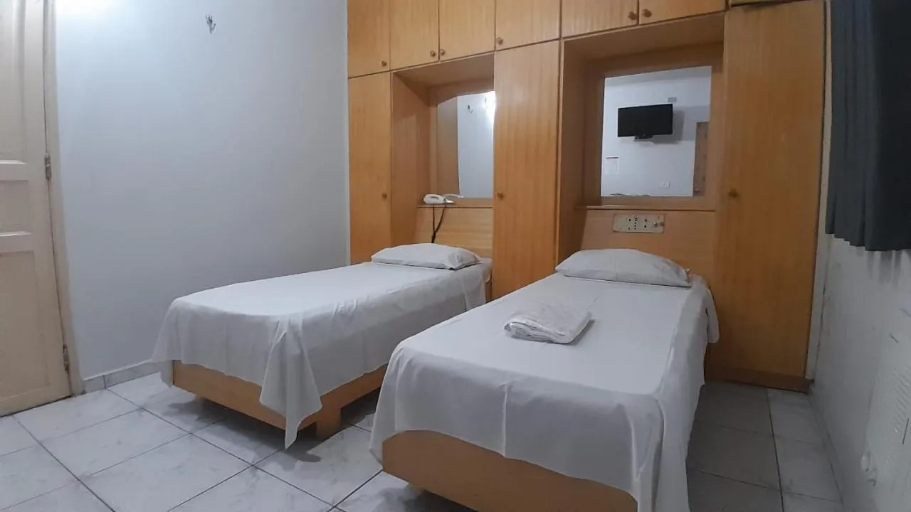 Bed in Center Plaza Hotel