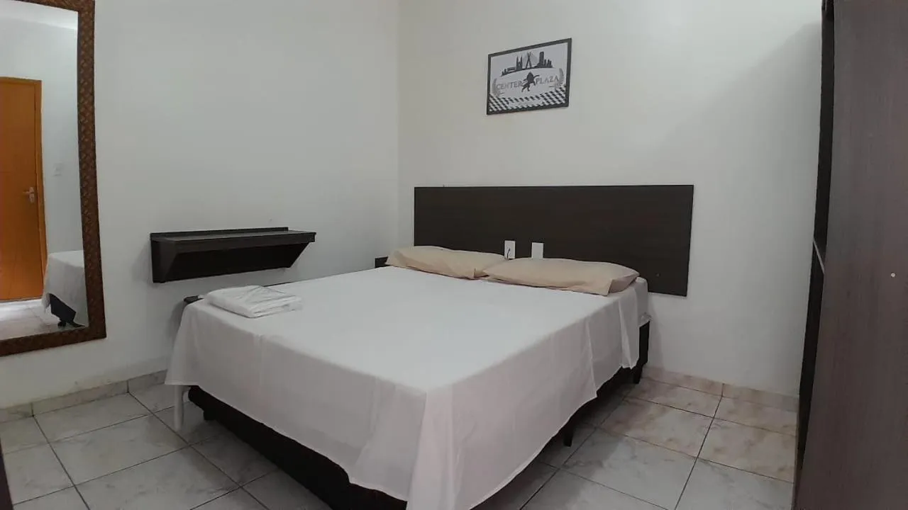 Bed in Center Plaza Hotel