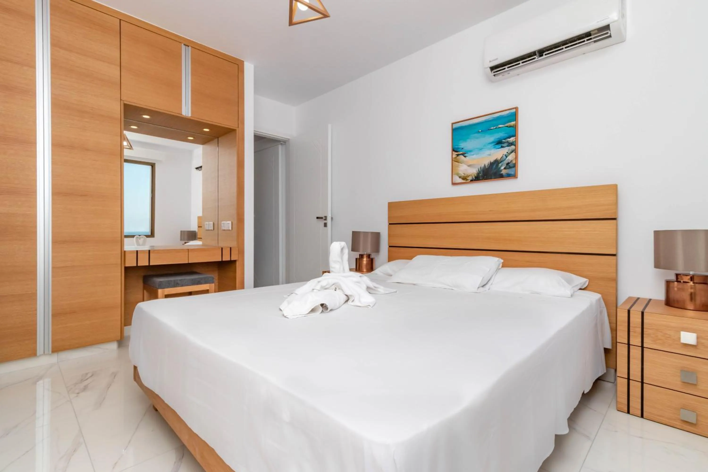 Bed in Rododafni Beach Apartments