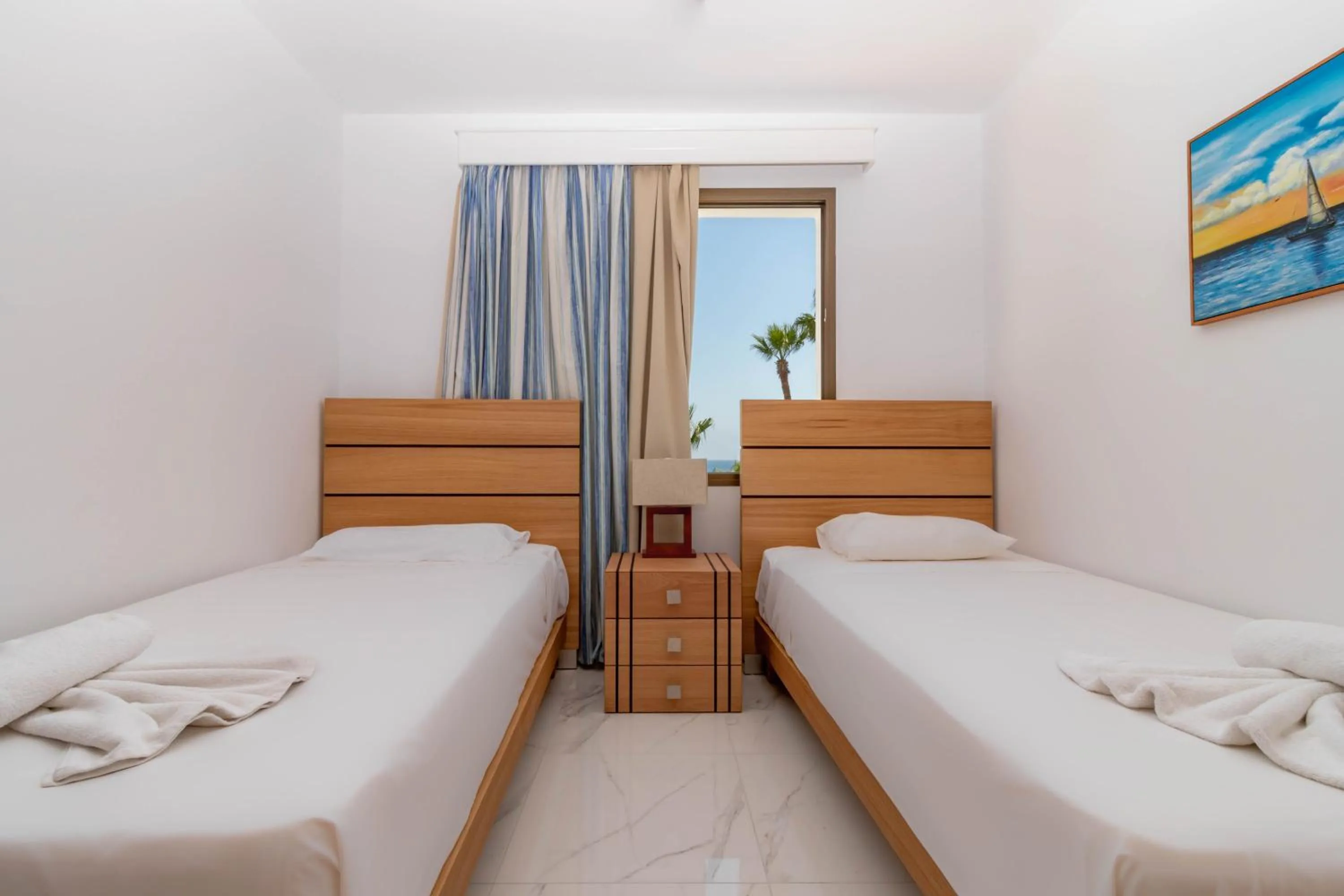 Bed in Rododafni Beach Apartments