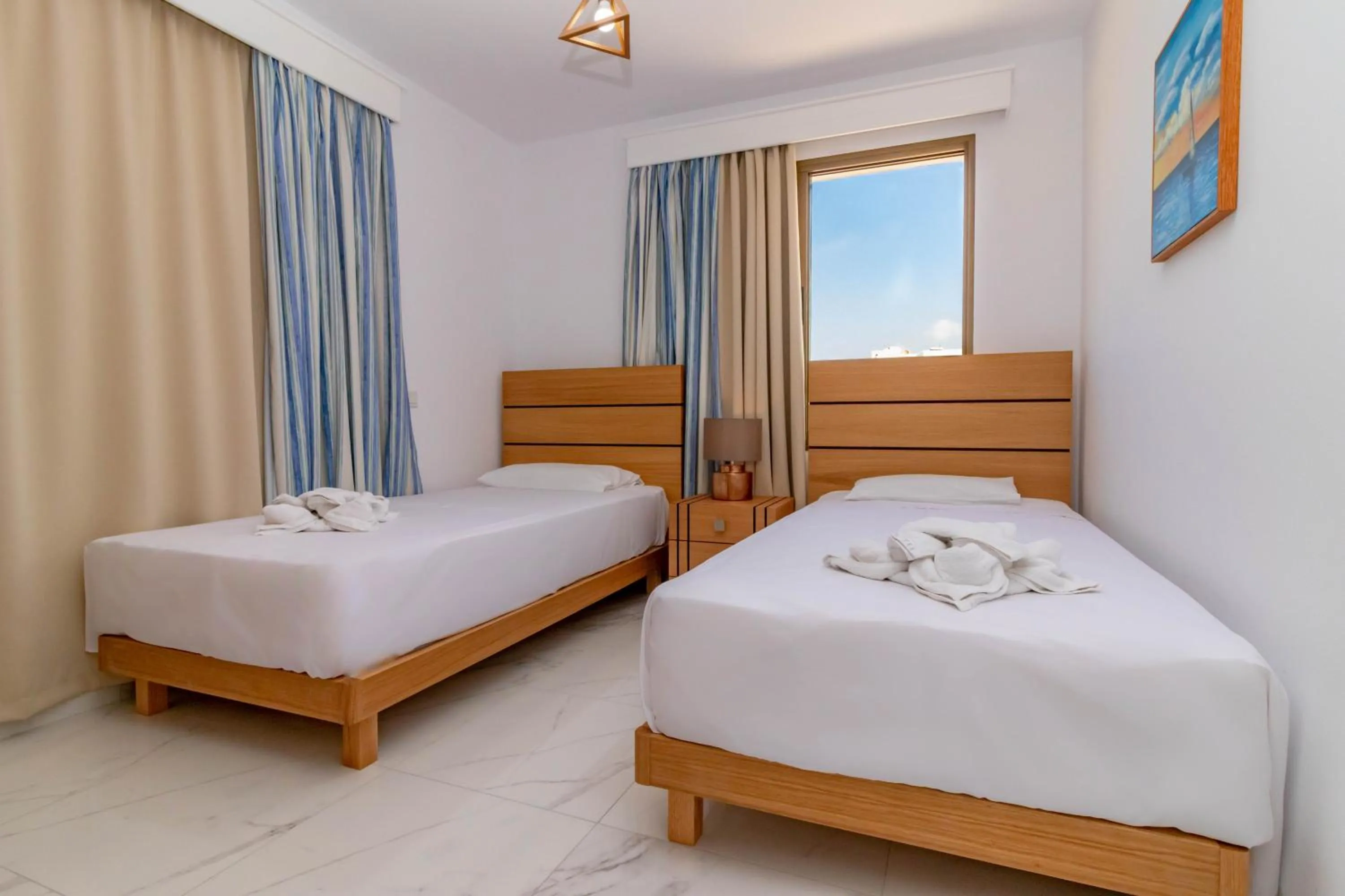 Bed in Rododafni Beach Apartments