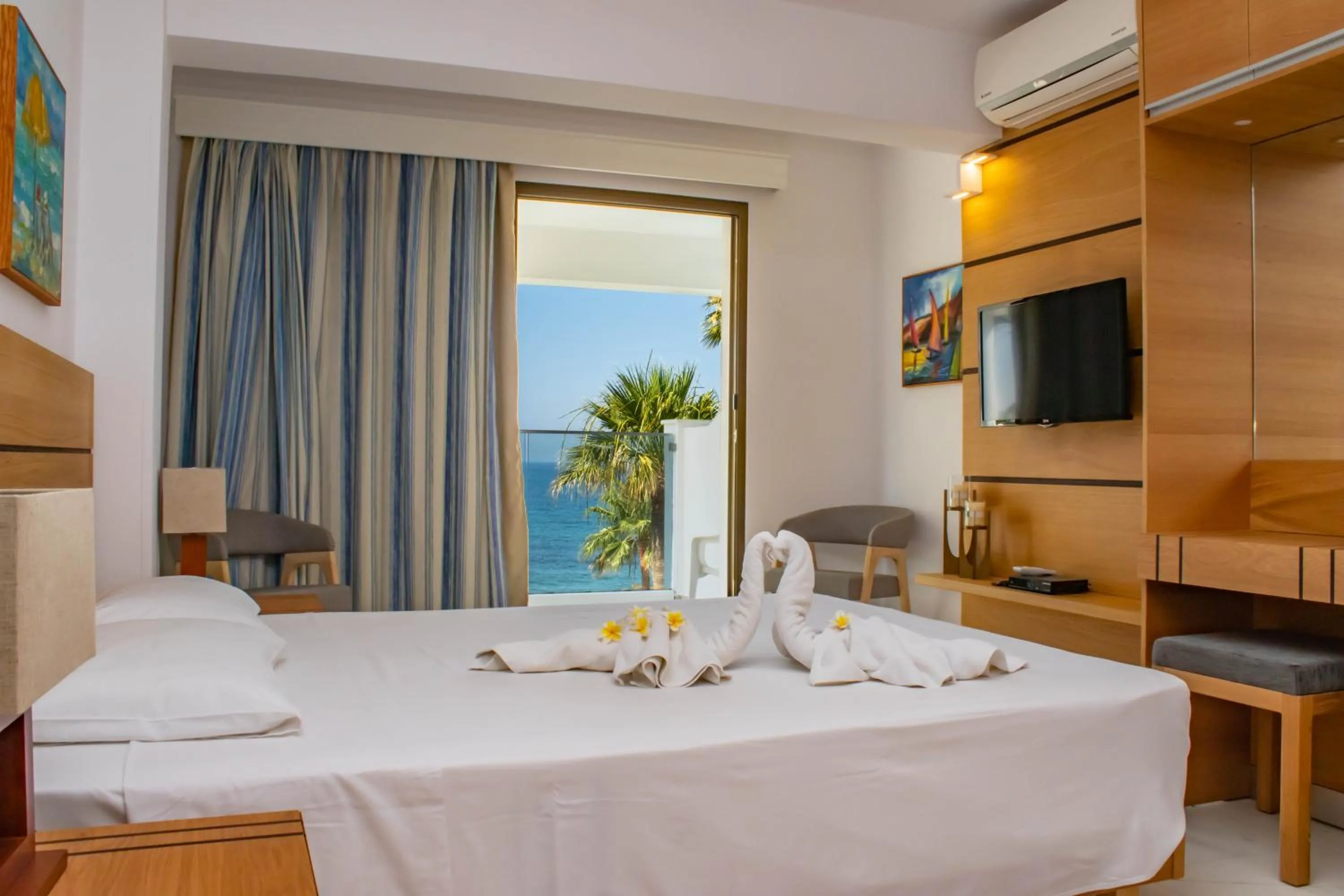 Bed in Rododafni Beach Apartments