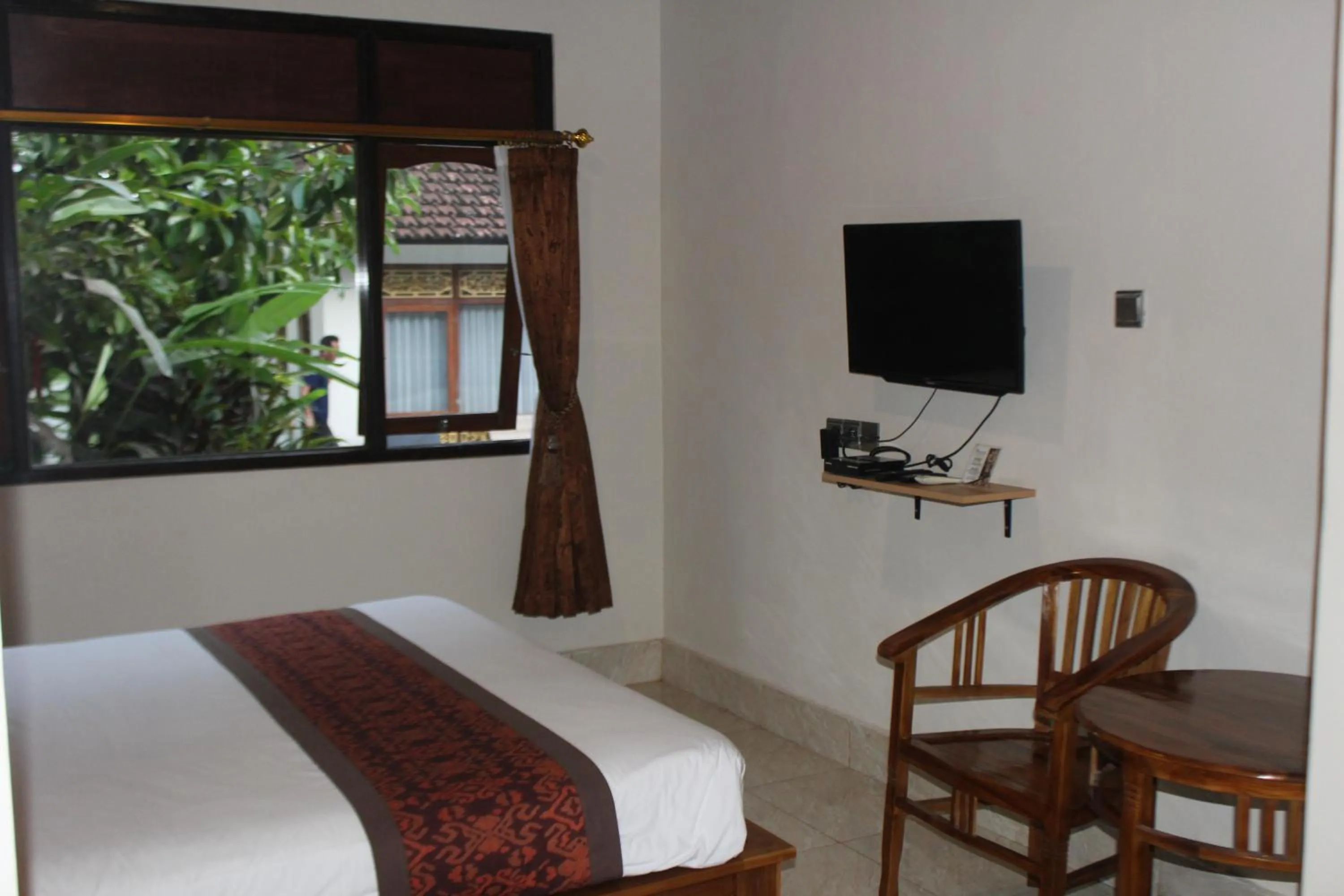 TV and multimedia, Bed in Balimas Guest House