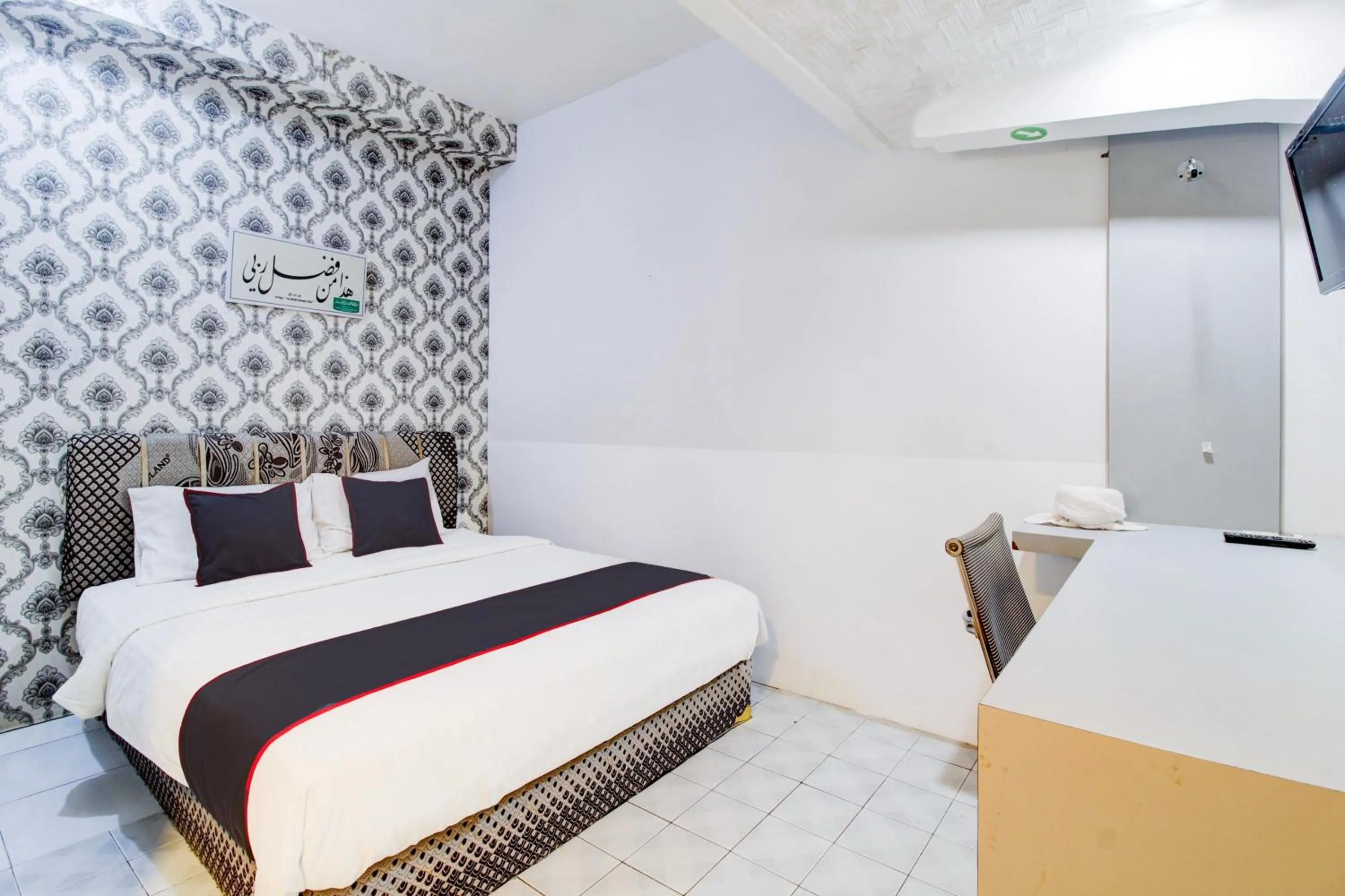 Bedroom, Bed in Hotel O Jalan Jenderal Sudirman Near Imam Bonjol Square Formerly Nelvi Guest House