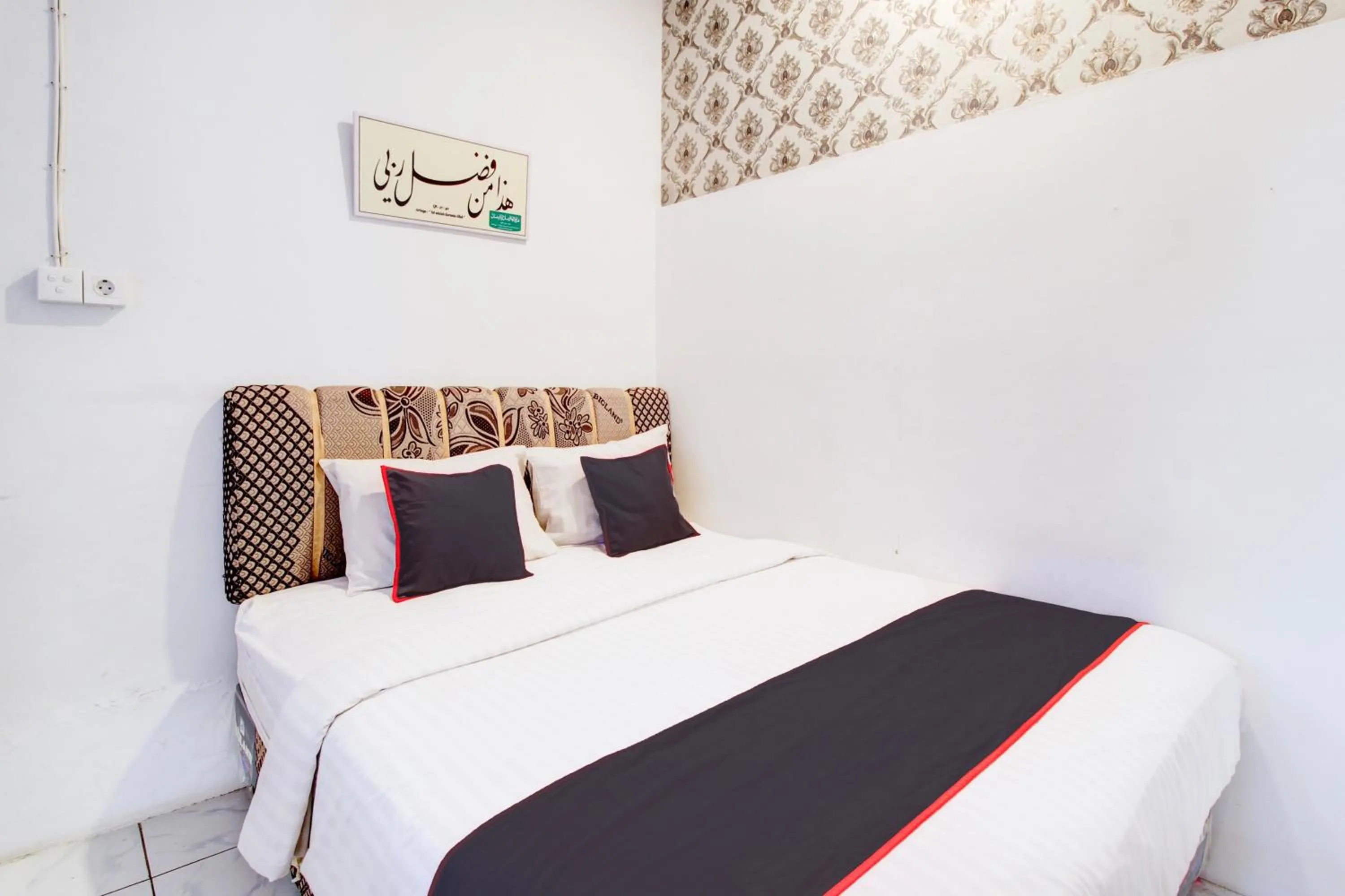 Bedroom, Bed in Hotel O Jalan Jenderal Sudirman Near Imam Bonjol Square Formerly Nelvi Guest House