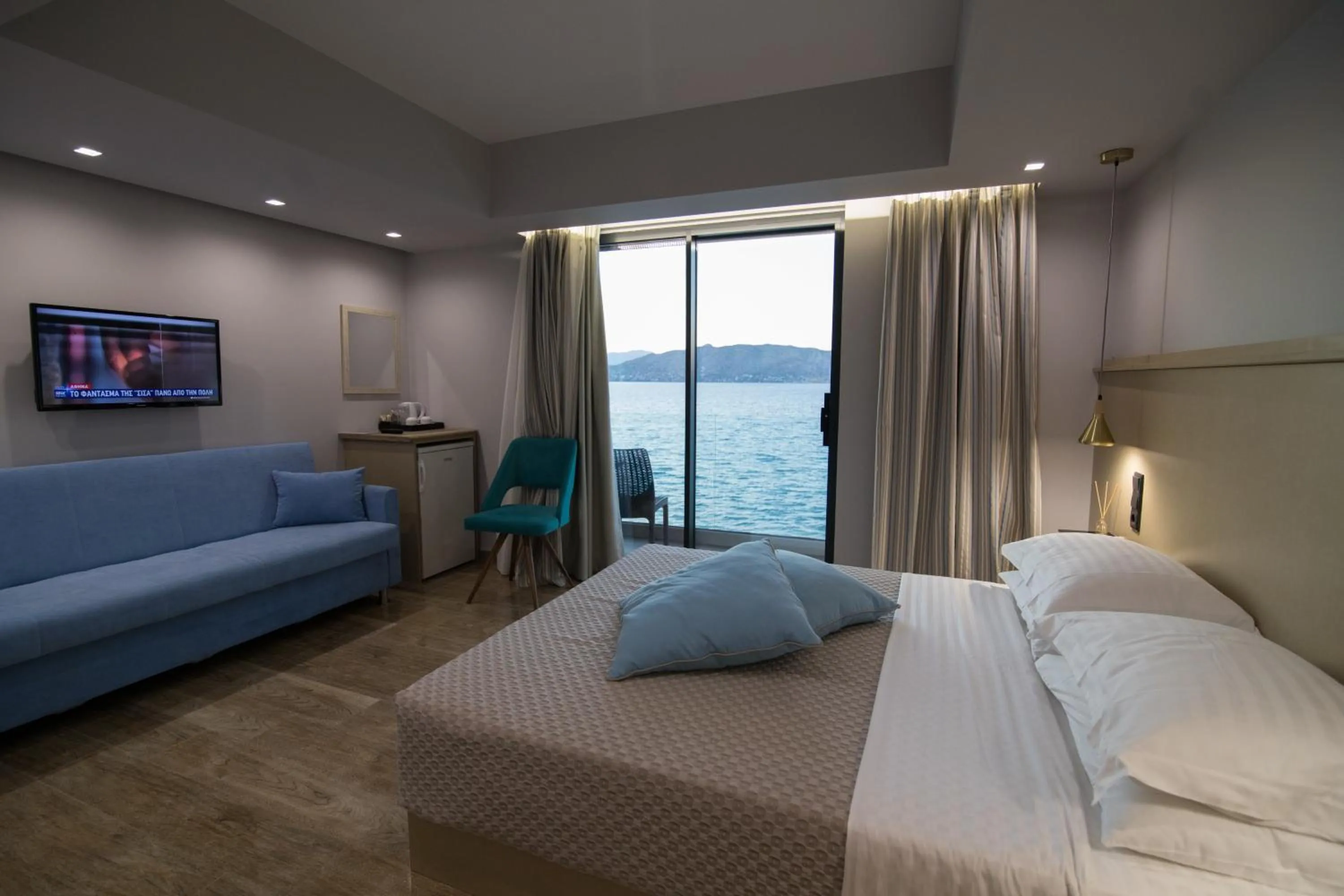 Photo of the whole room, Bed in Aianteion Bay Luxury Hotel & Suites