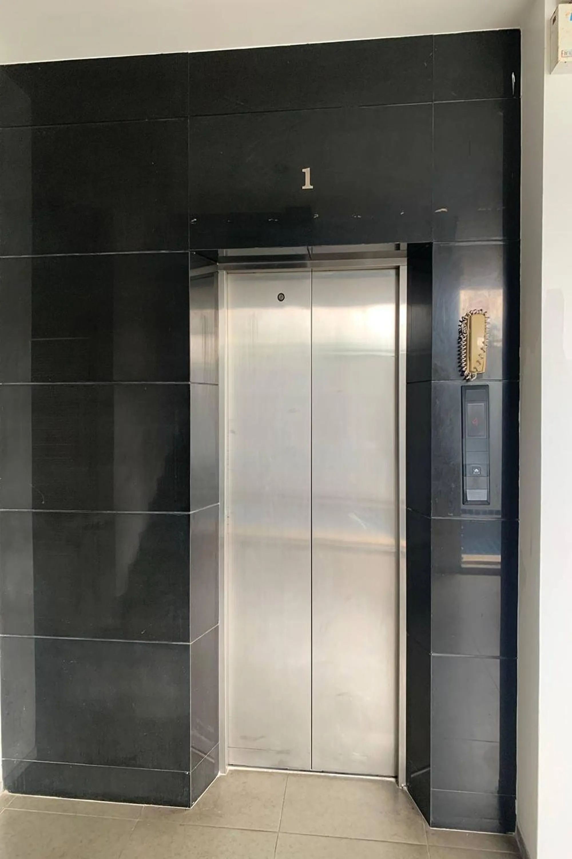 elevator in One World One Home Naiharn Hotel