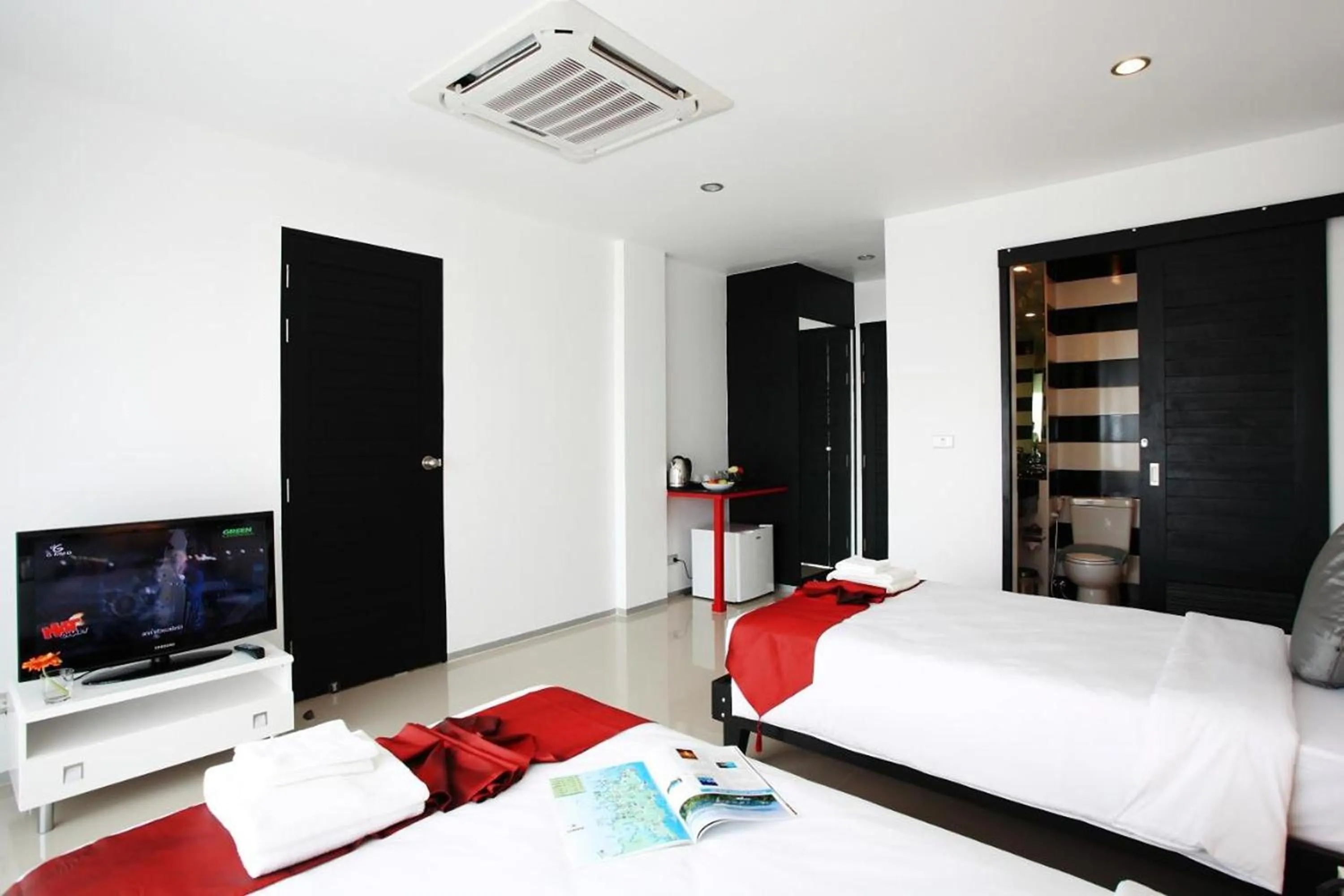 Bed in One World One Home Naiharn Hotel