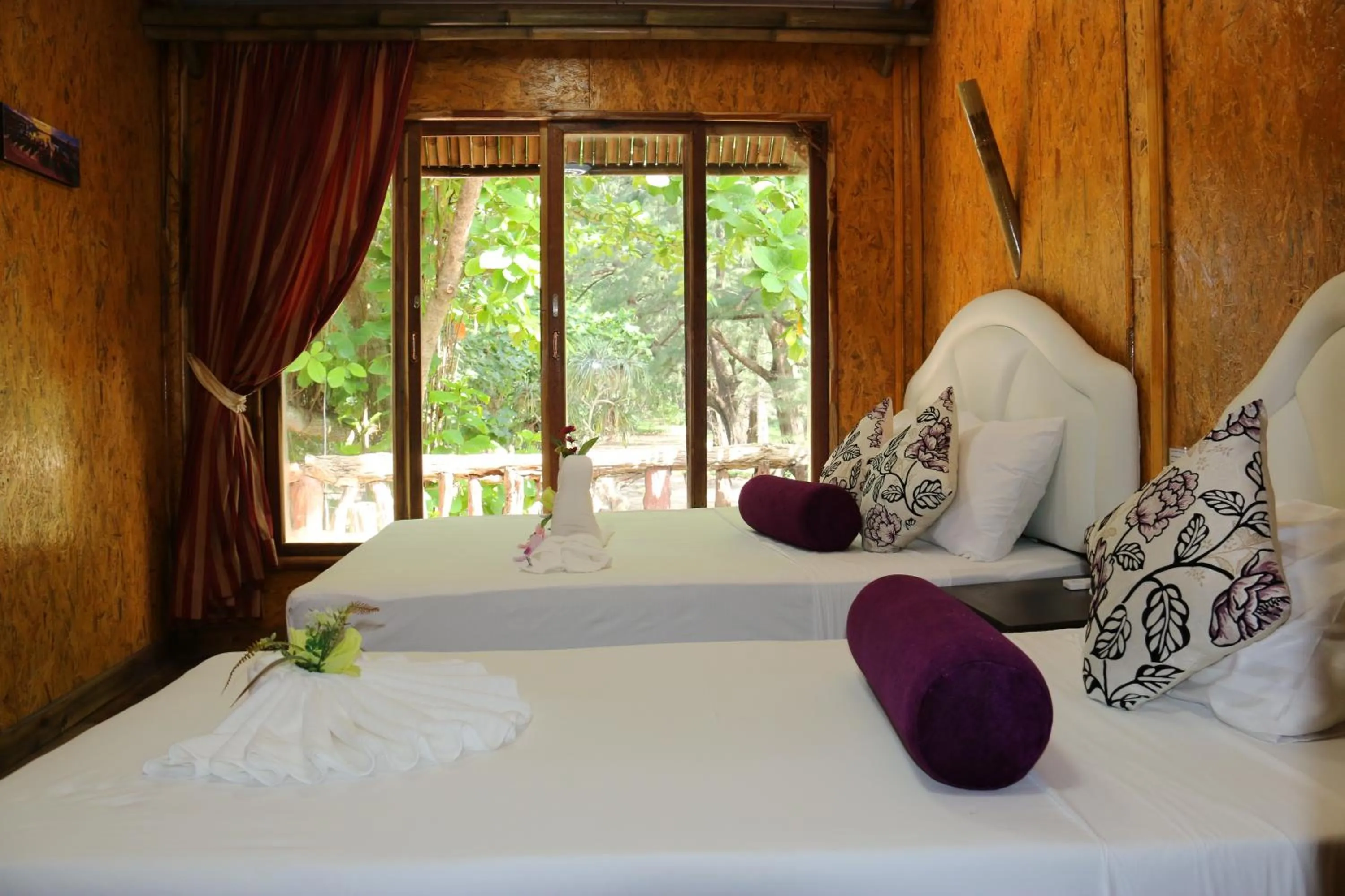 Bed in Ruan Mai Naiyang Beach Resort