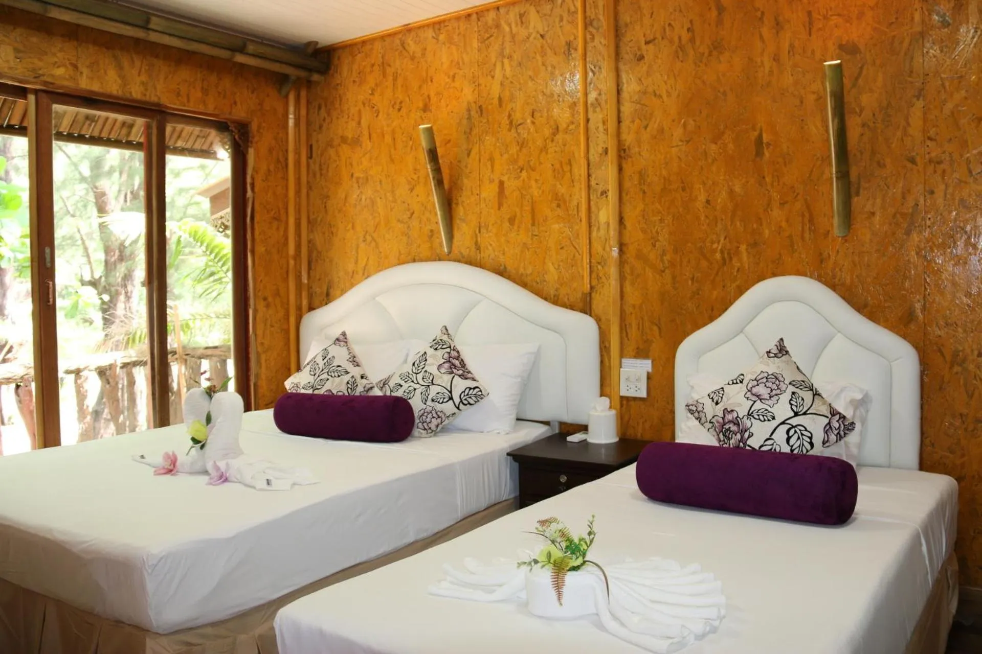 Bed in Ruan Mai Naiyang Beach Resort