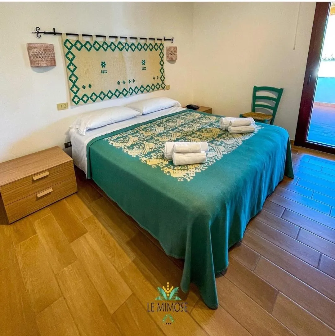 Bed in Hotel Le Mimose