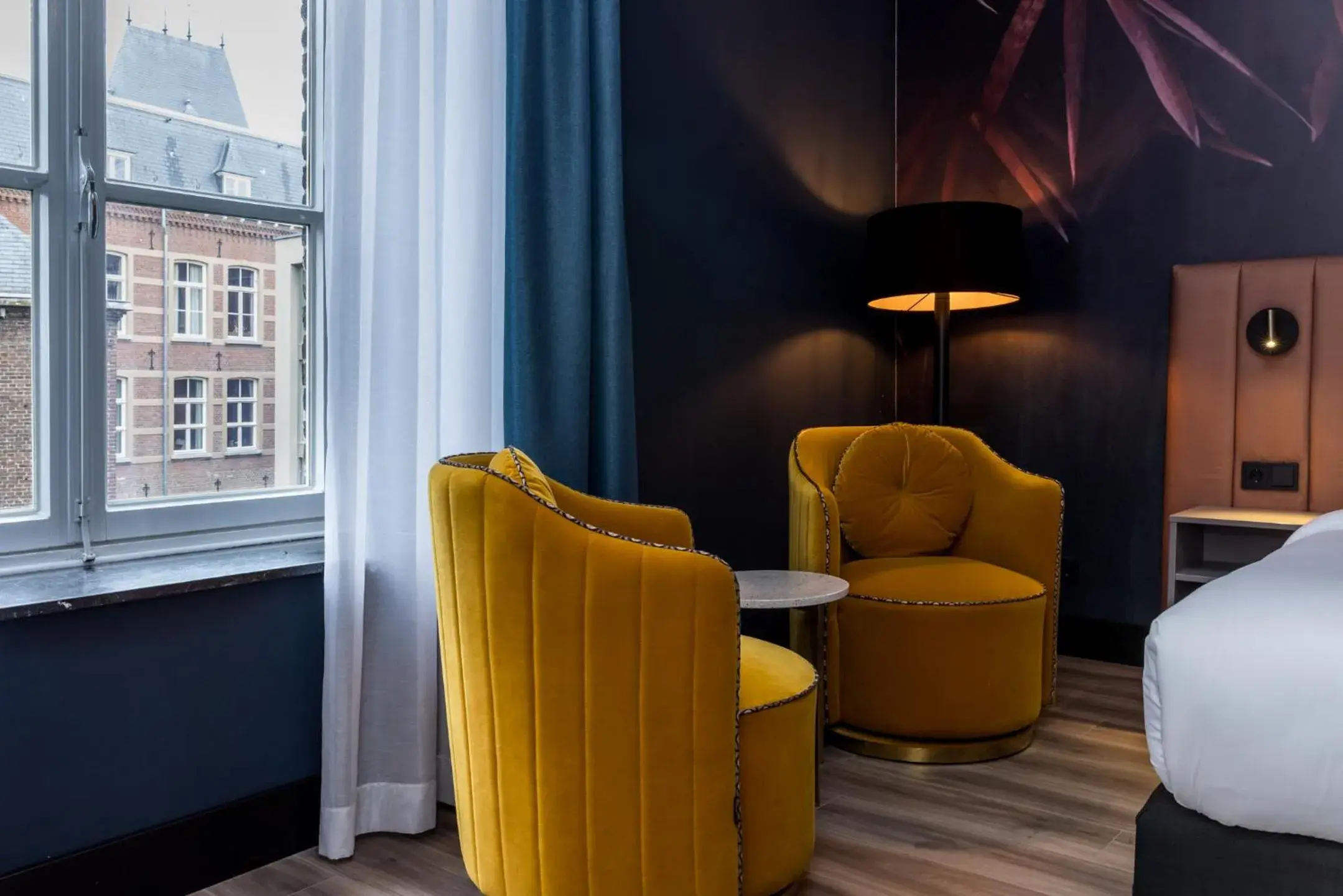 Seating area, Bed in MERICI Hotel Sittard Seating area, Bed in MERICI Hotel Sittard