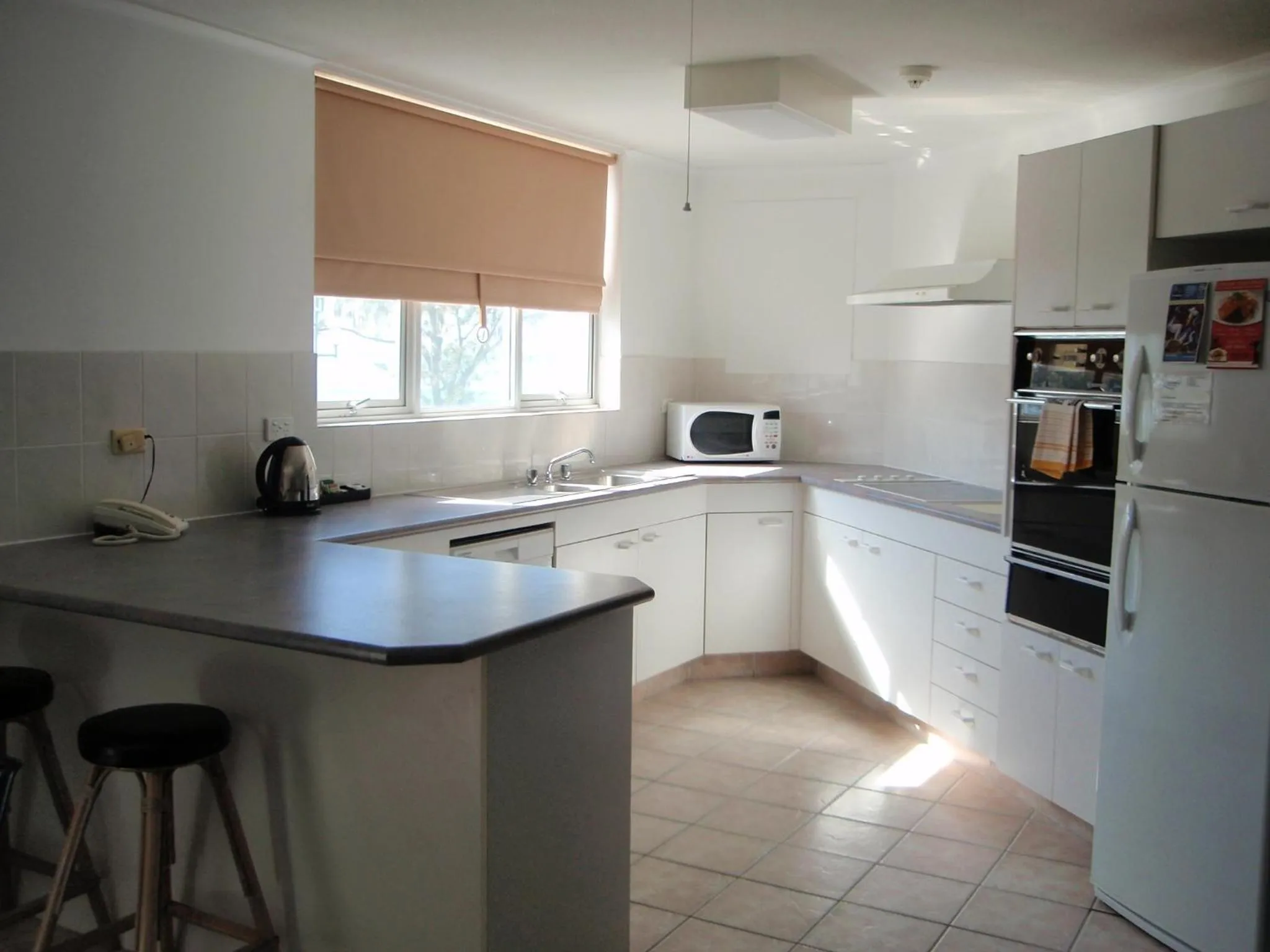 kitchen in Grosvenor Beachfront Apartments Surfers Paradise