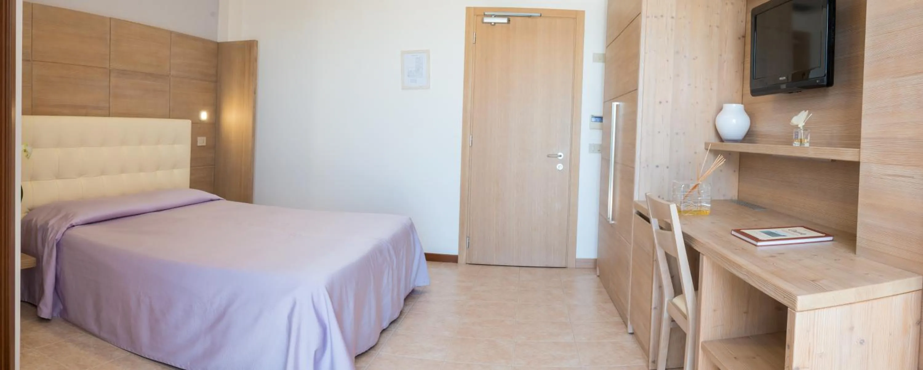 Bed in Hotel Nettuno