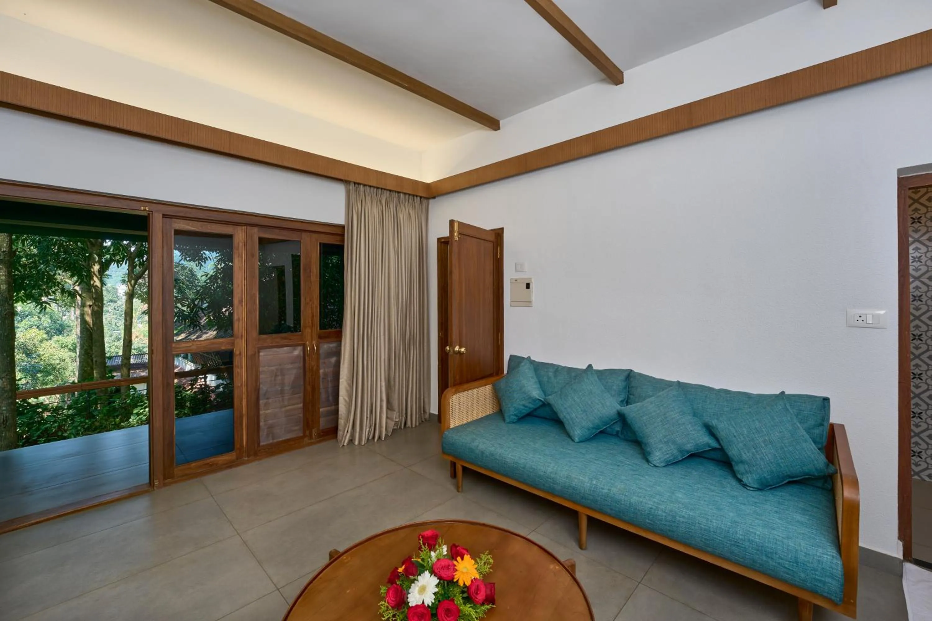 Living room in Cardamom County by Xandari