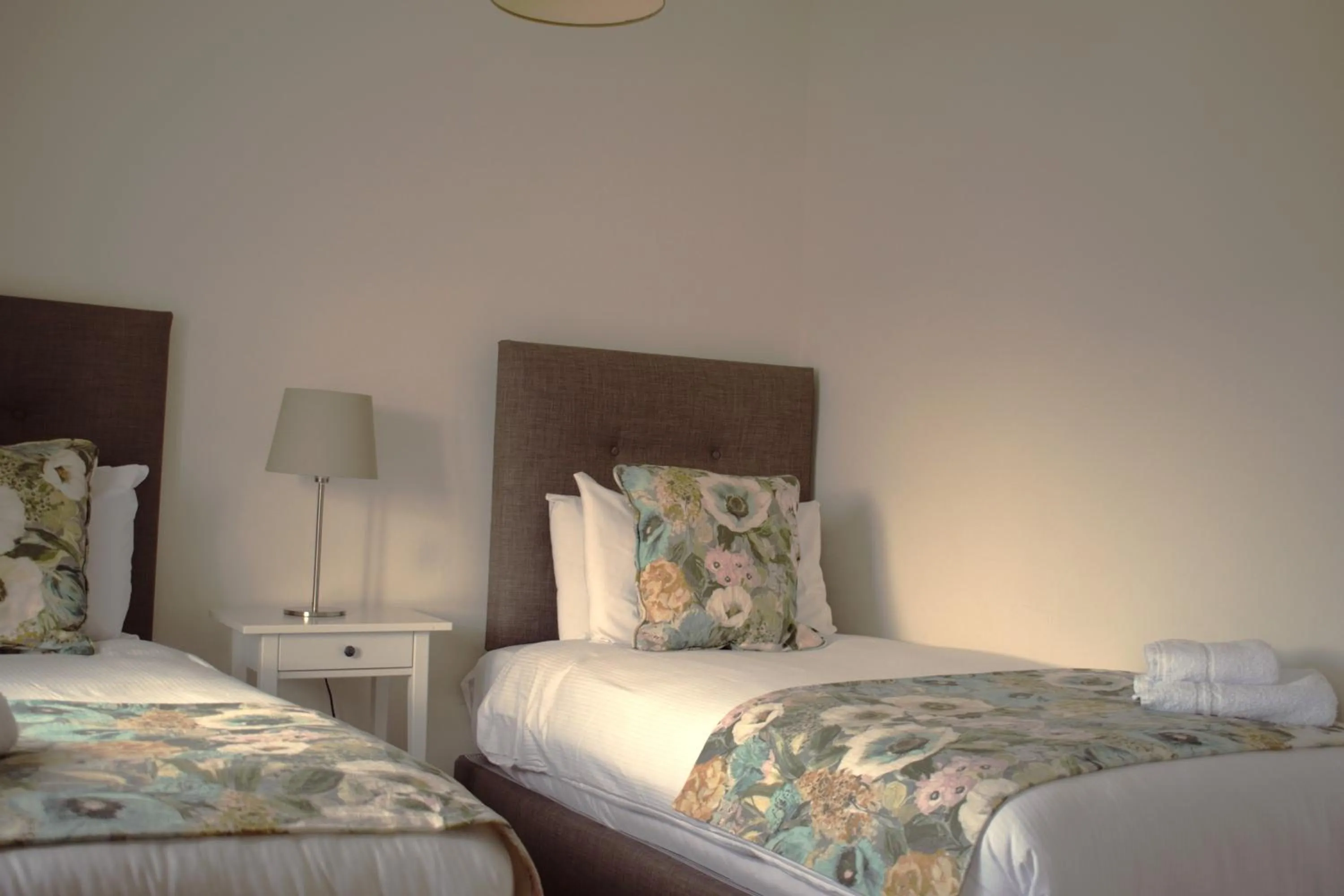 Bed in Tom Dick and Harriet's Accommodation