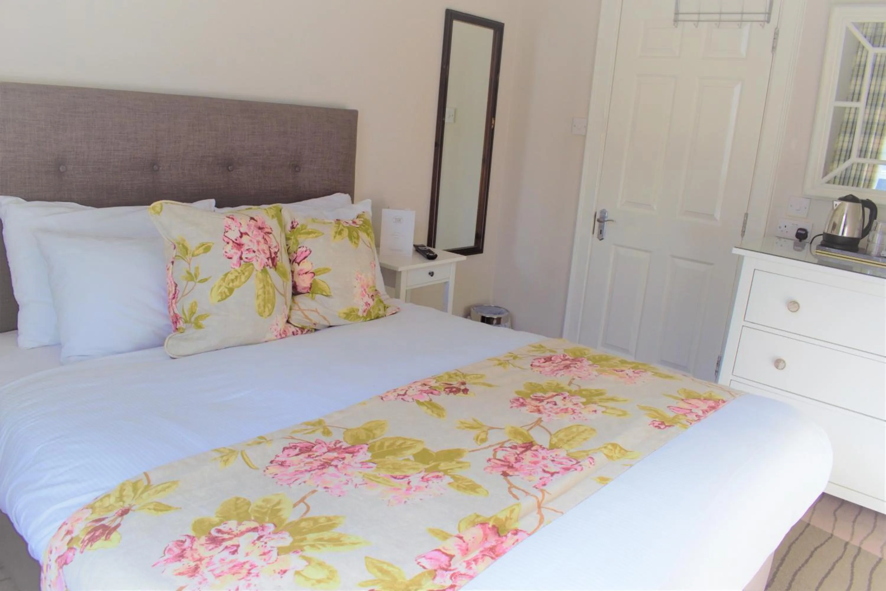 Bed in Tom Dick and Harriet's Accommodation