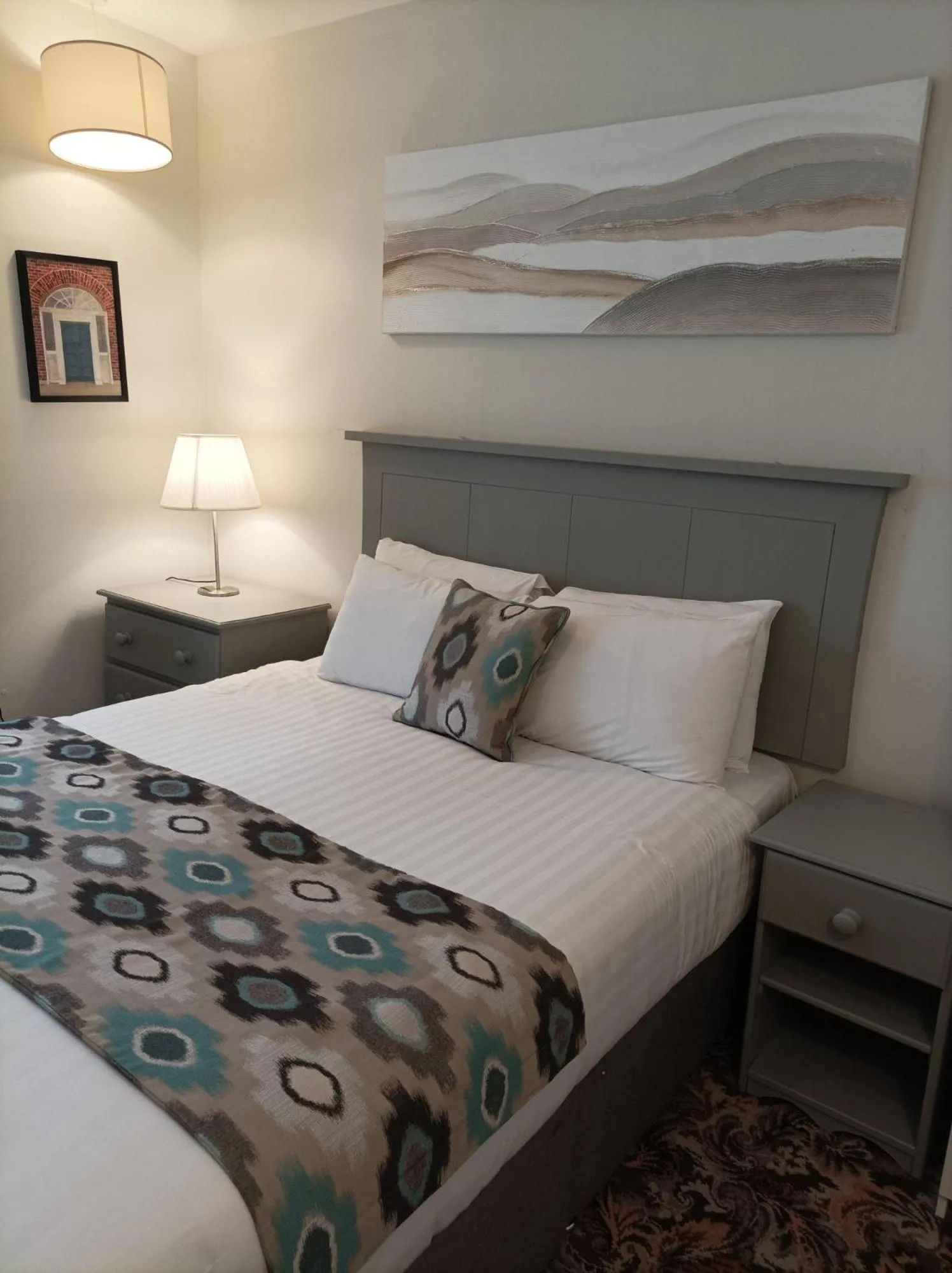 Bed in Tom Dick and Harriet's Accommodation