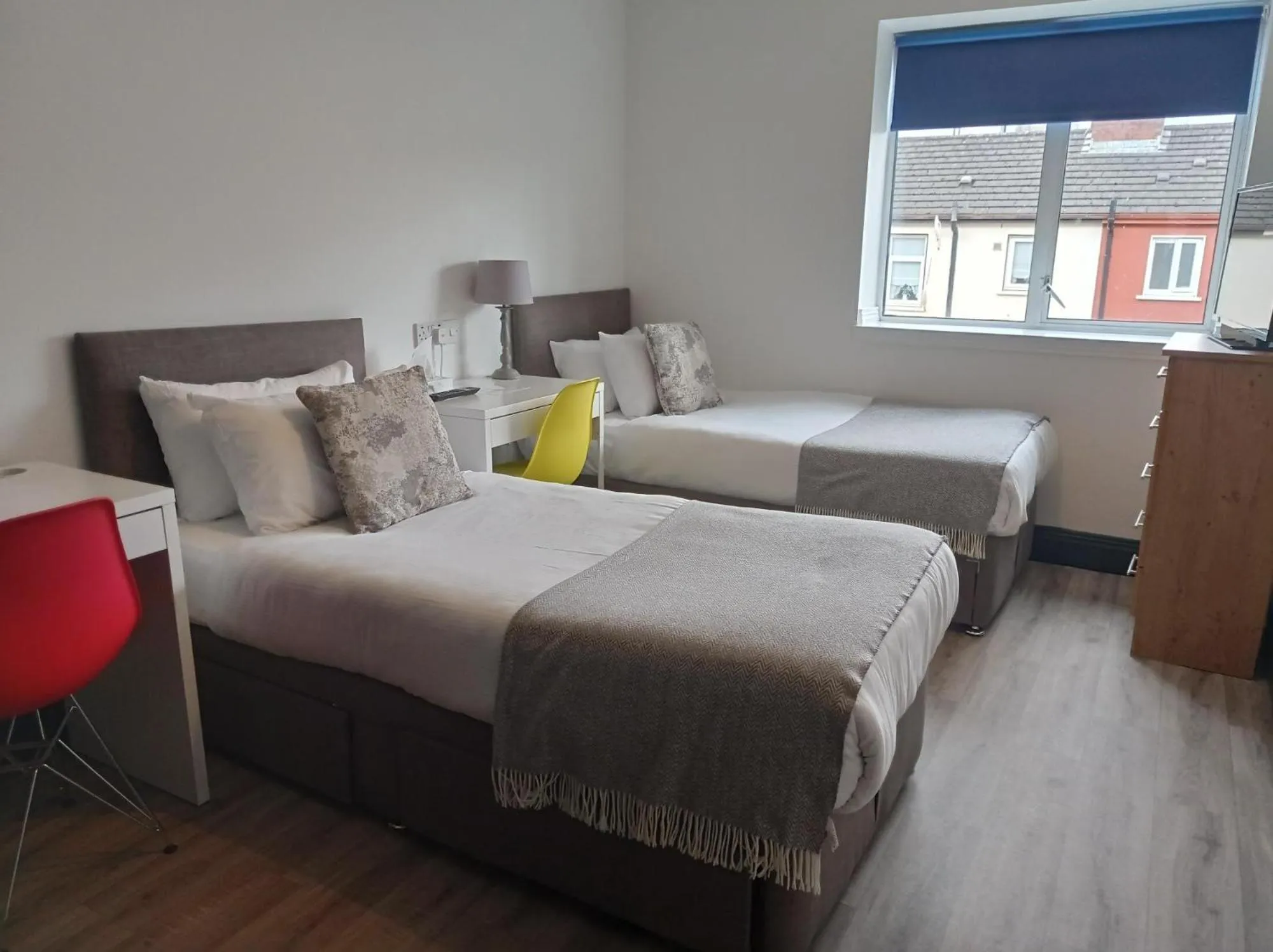 Bed in Tom Dick and Harriet's Accommodation