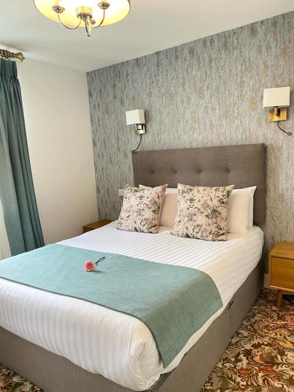 Bed in Tom Dick and Harriet's Accommodation