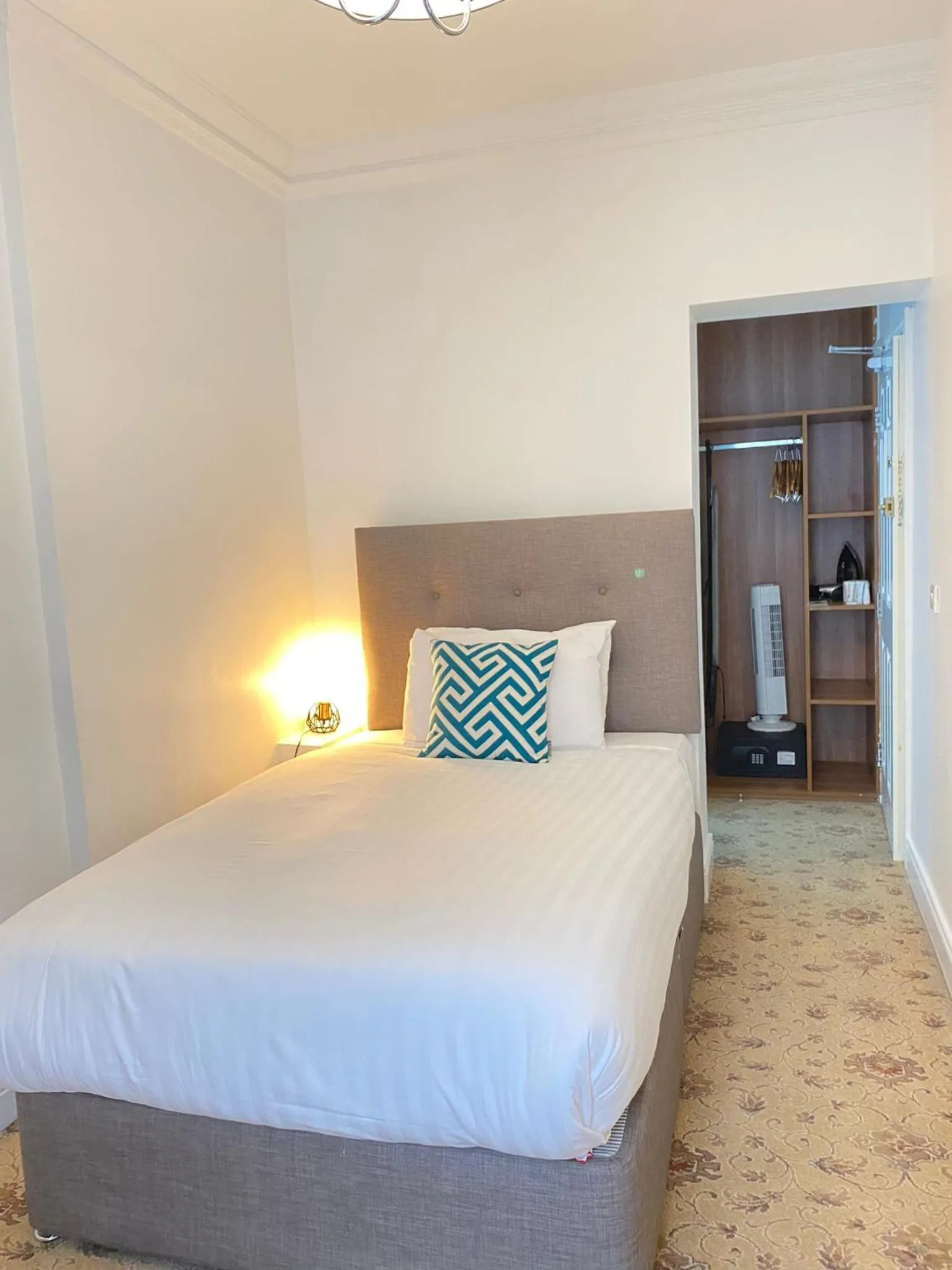 Bed in Tom Dick and Harriet's Accommodation