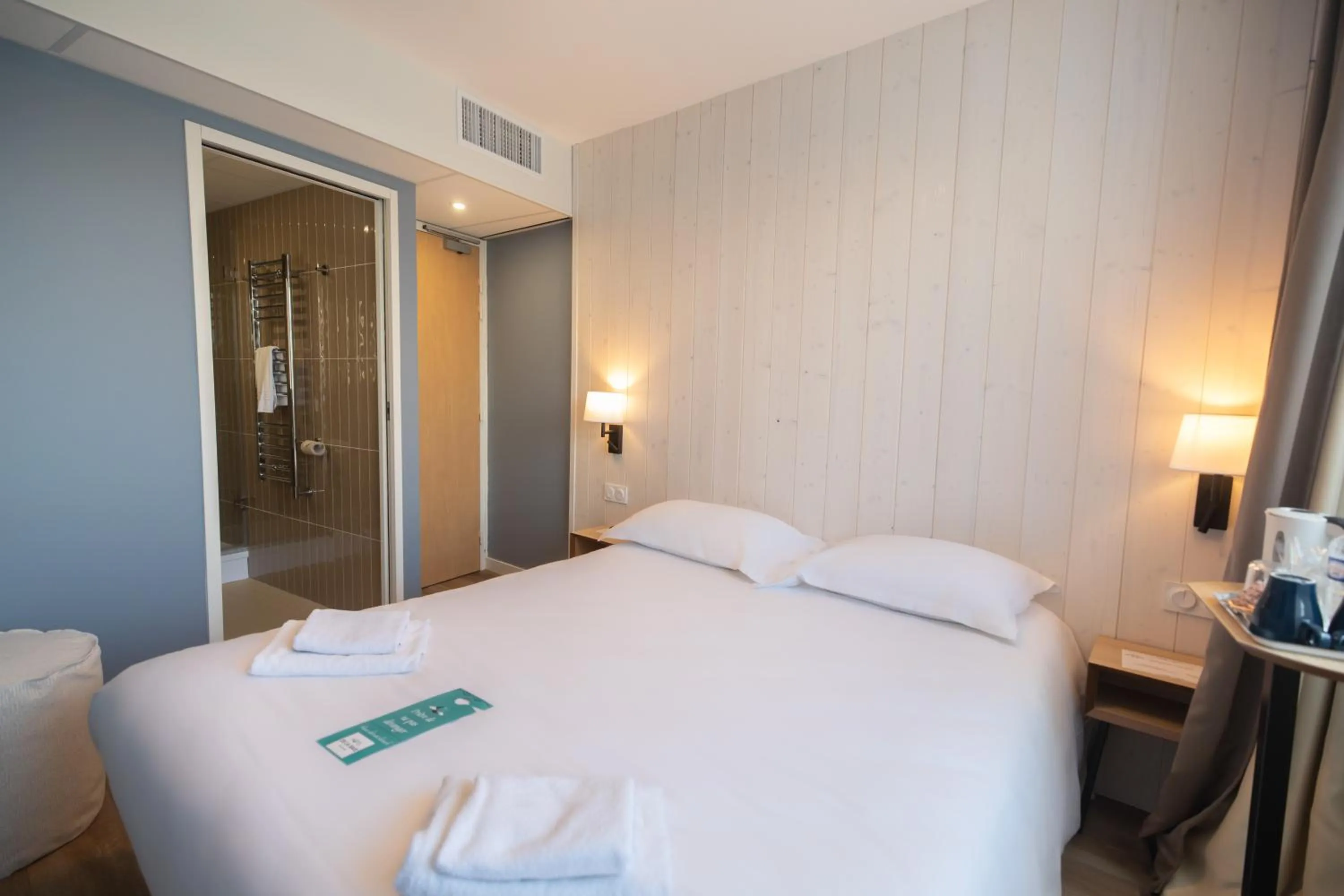 Photo of the whole room, Bed in Hôtel de la Baie