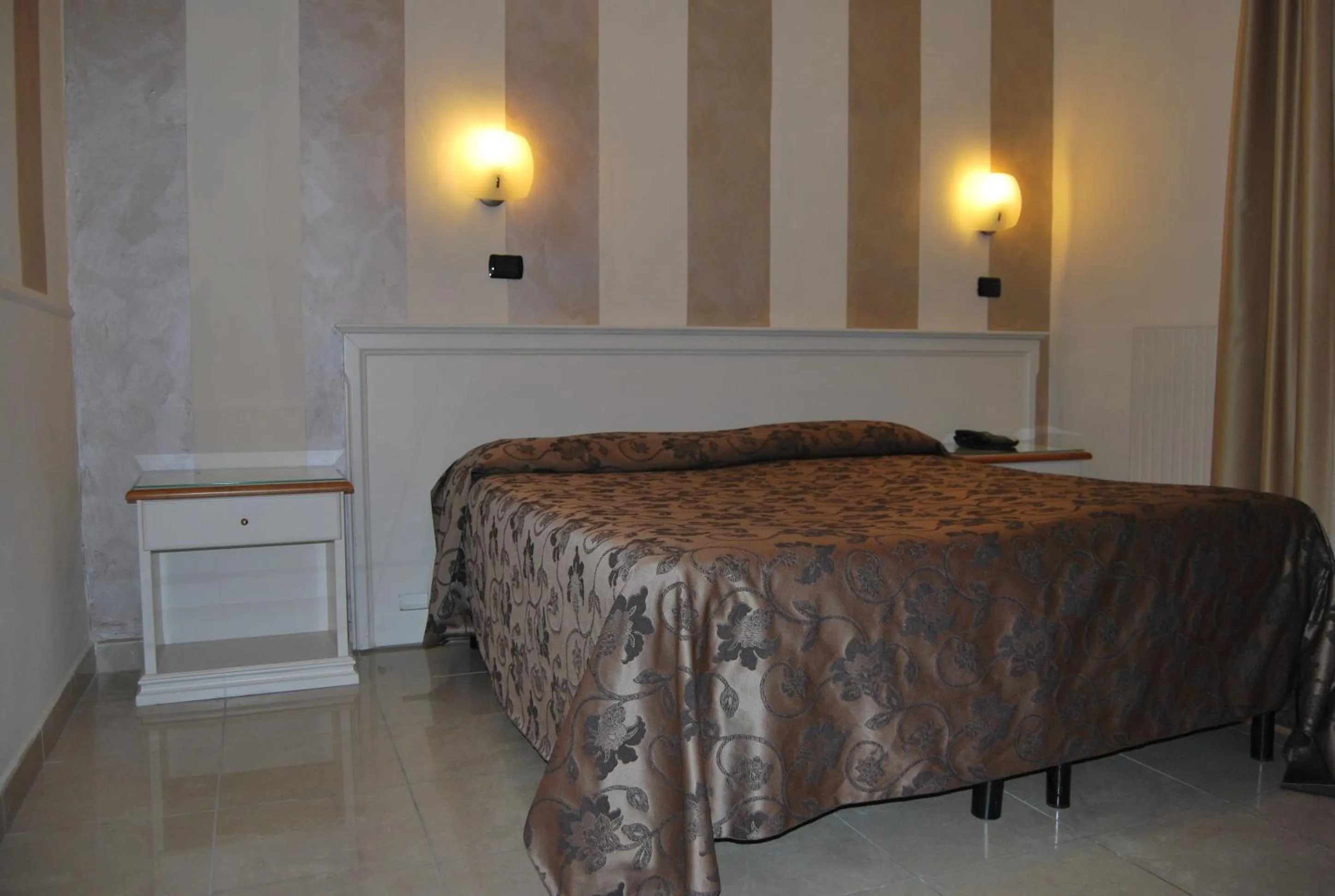 Bed in Hotel Coluccini