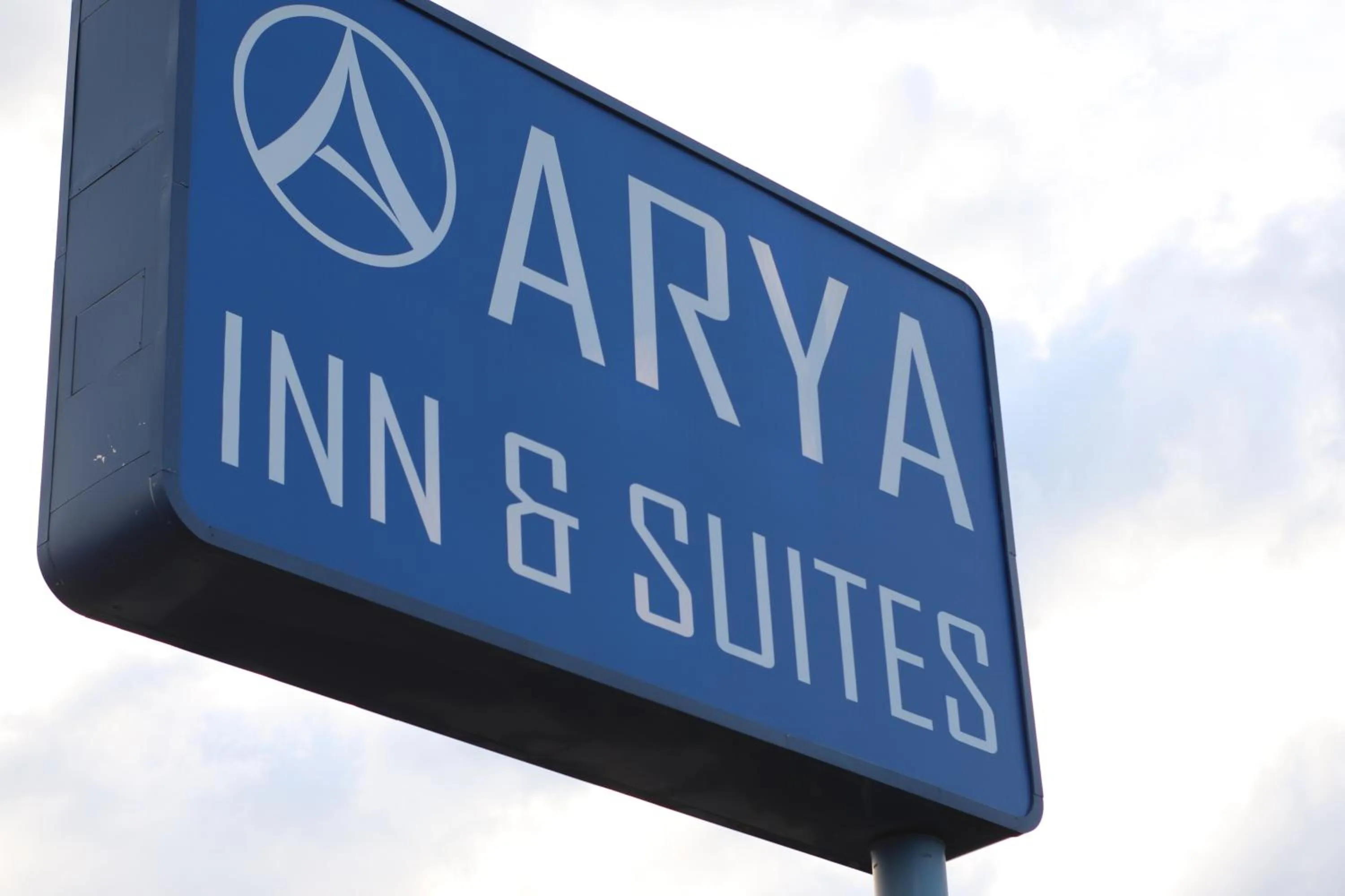 Property logo or sign in Arya Inn and Suites