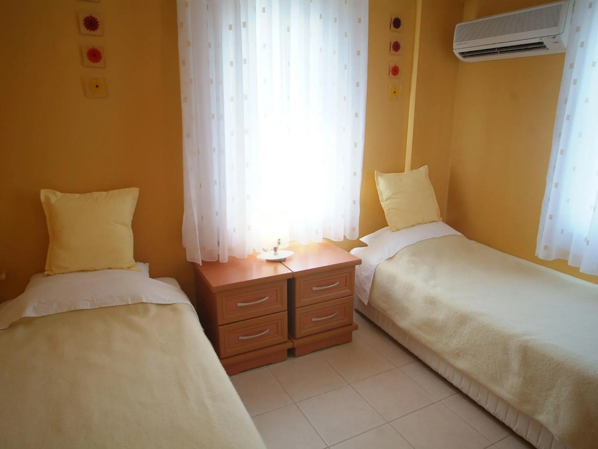 Bed in Sea Breeze Hotel and Apartments