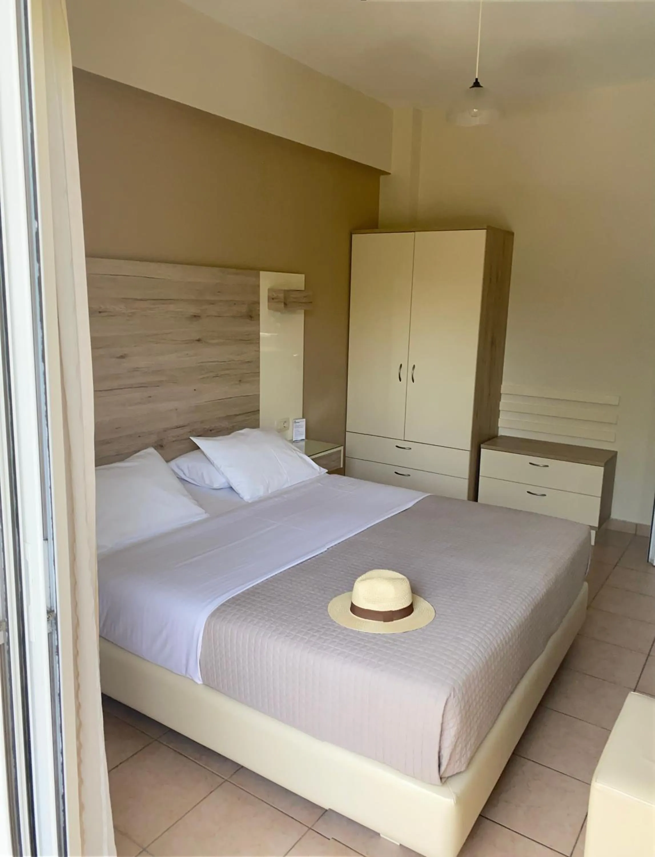 Bed in Poseidon Studios & Apartments