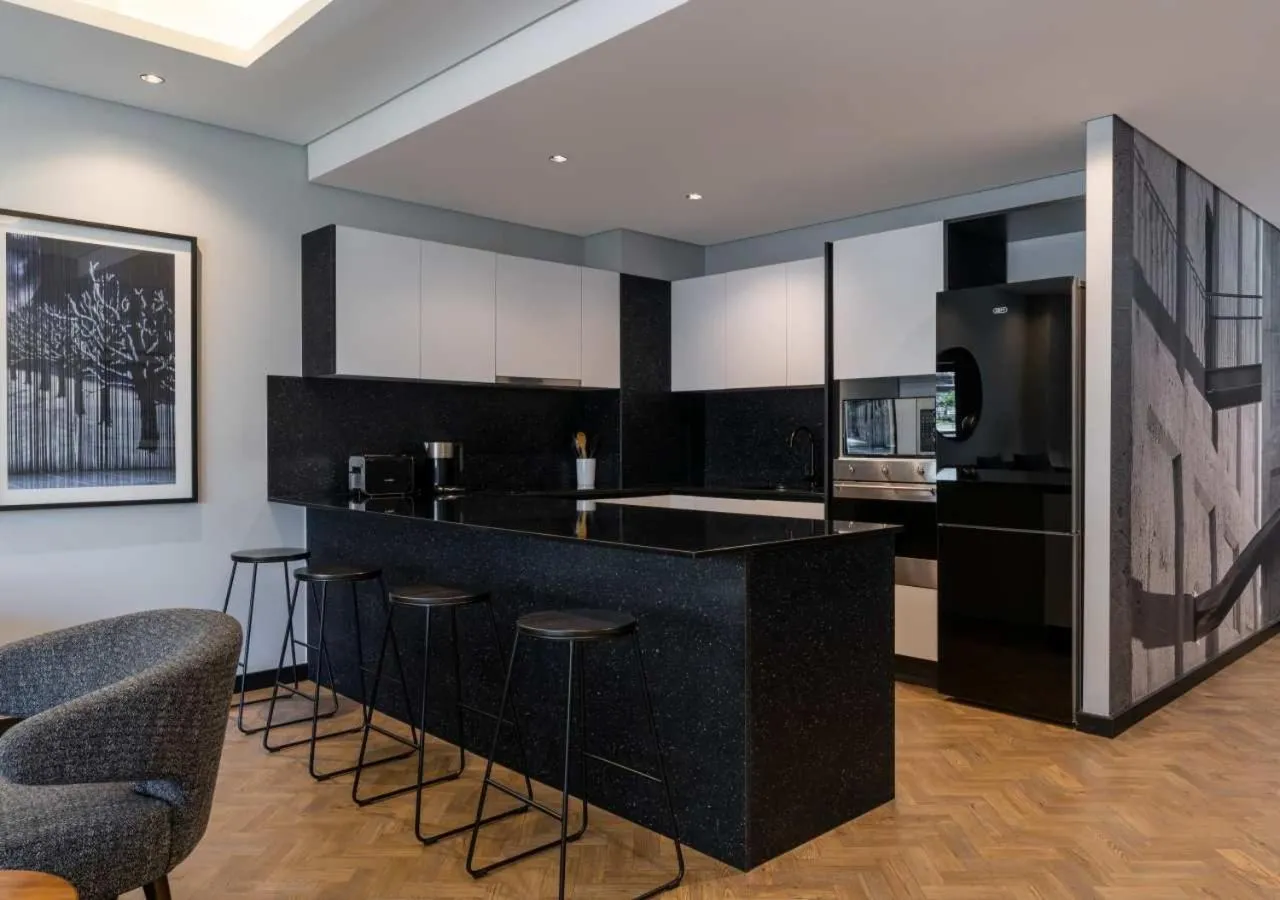 Kitchen or kitchenette in The Onyx Apartment Hotel by NEWMARK