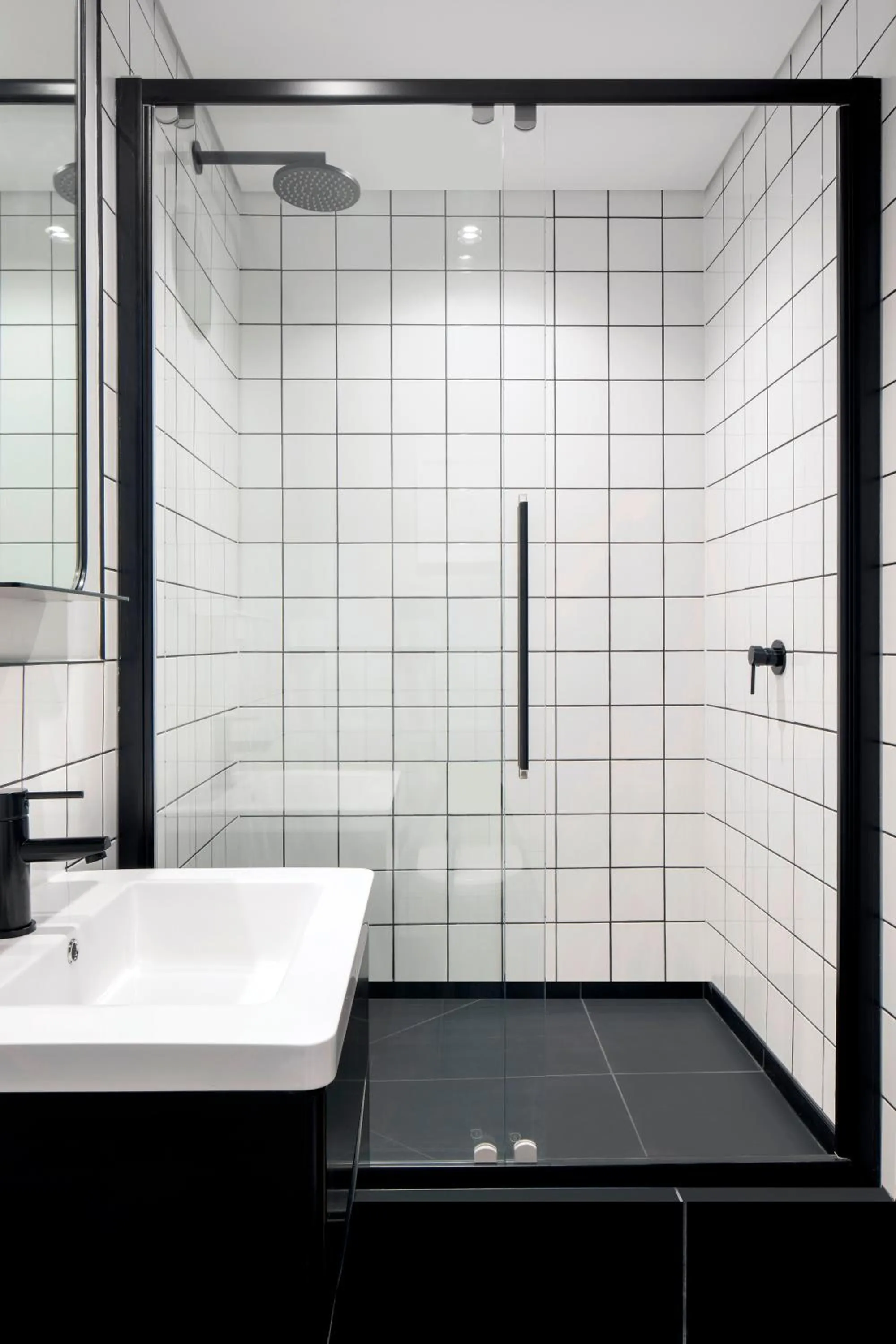 Shower in The Onyx Apartment Hotel by NEWMARK