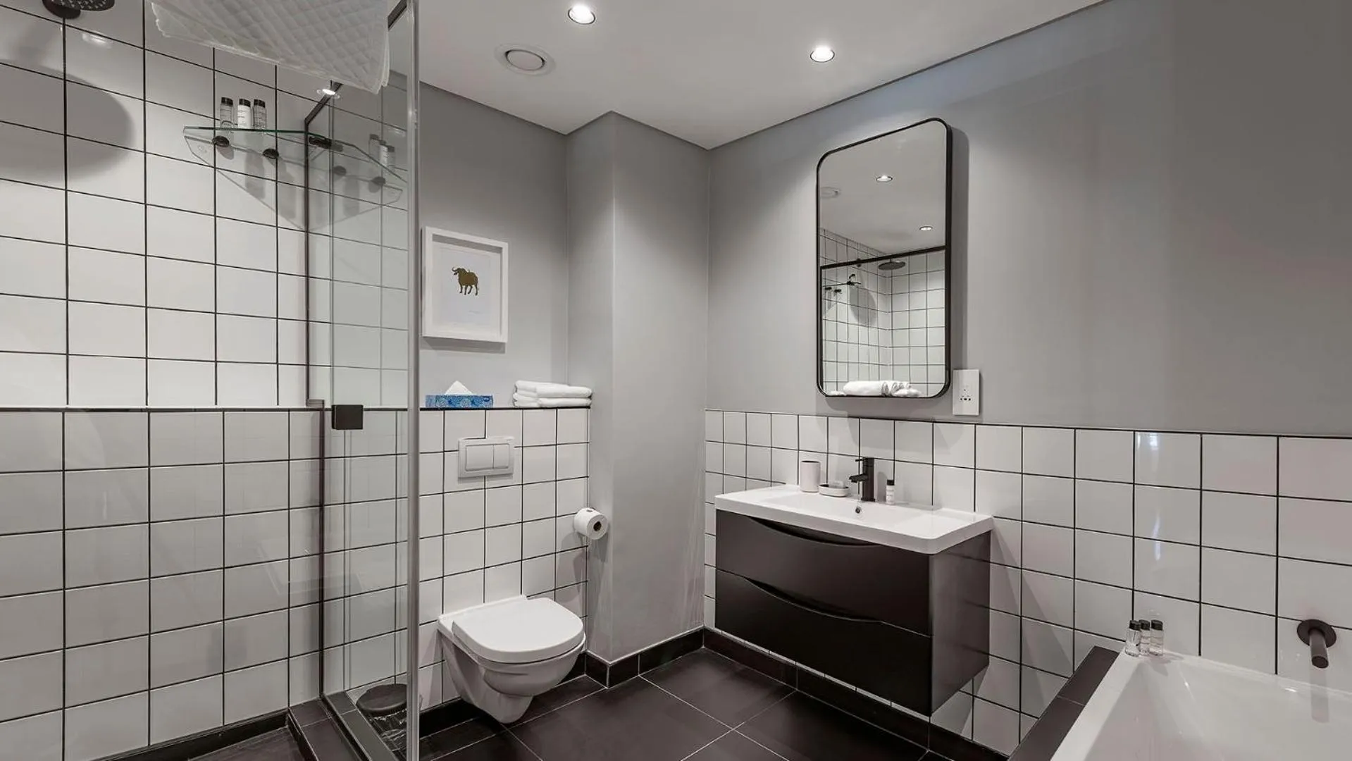 Shower in The Onyx Apartment Hotel by NEWMARK