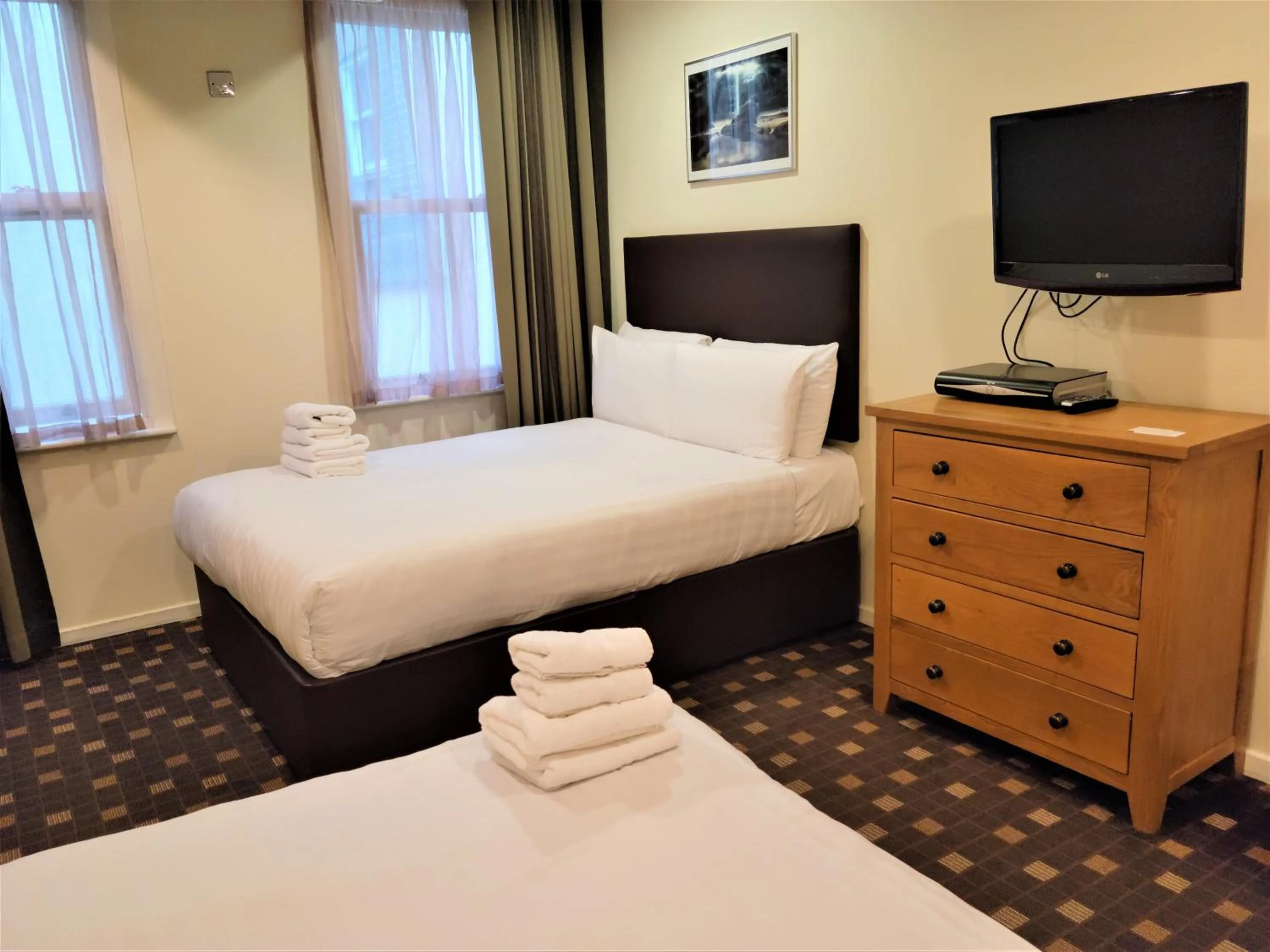 Living room, Bed in Grand Plaza Serviced Apartments