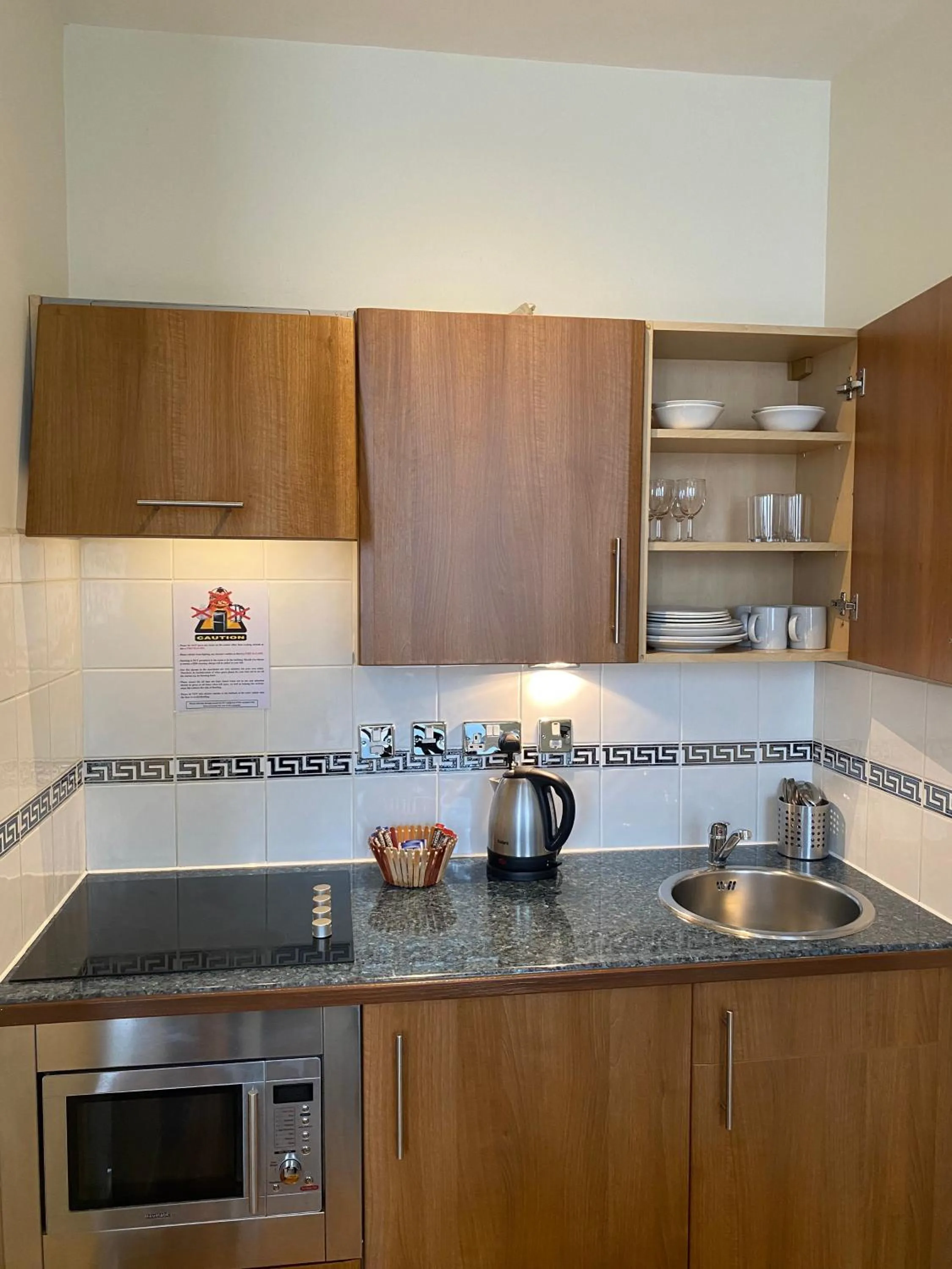 Kitchen or kitchenette in Grand Plaza Serviced Apartments