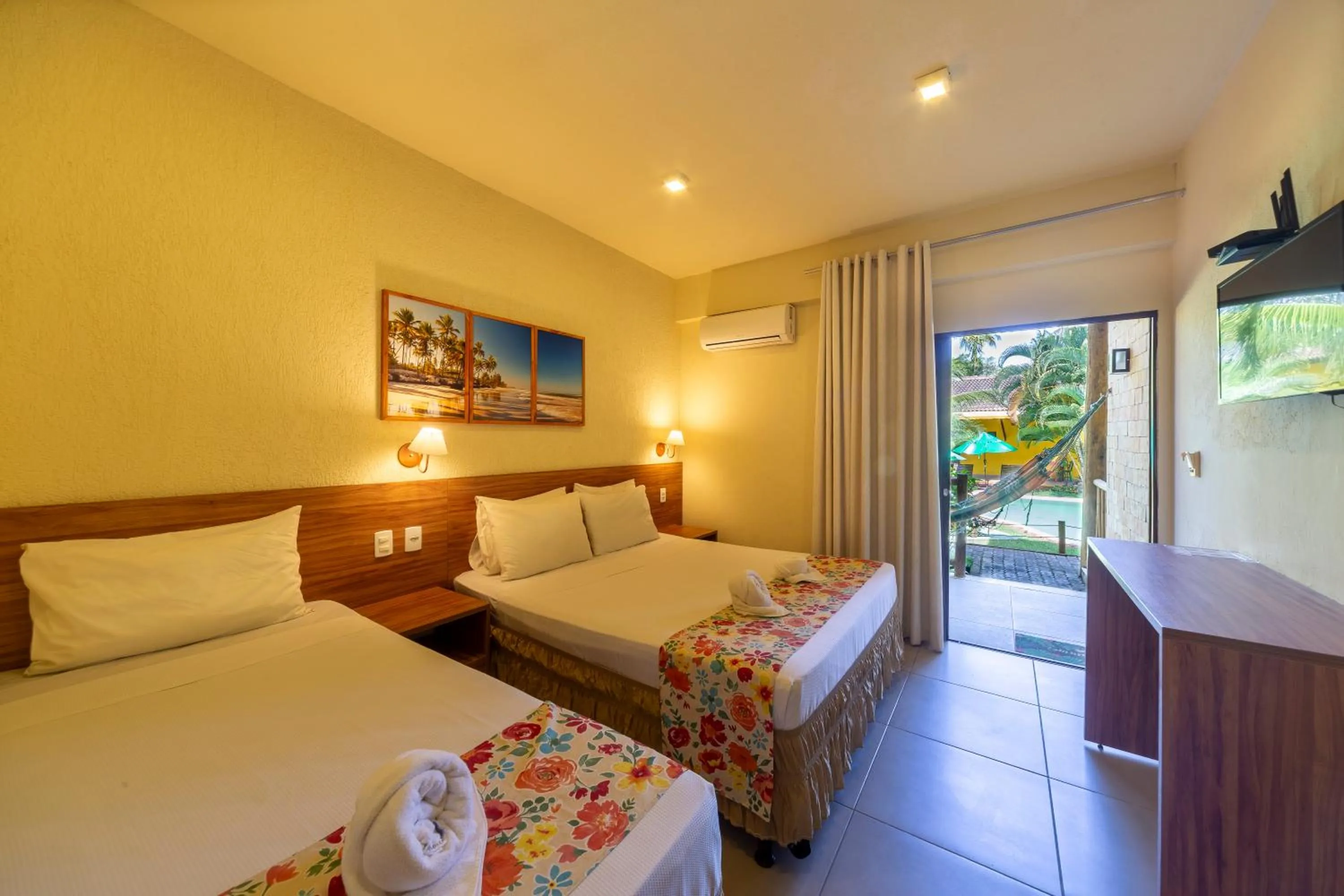 Bed in Pousada Tropicarim