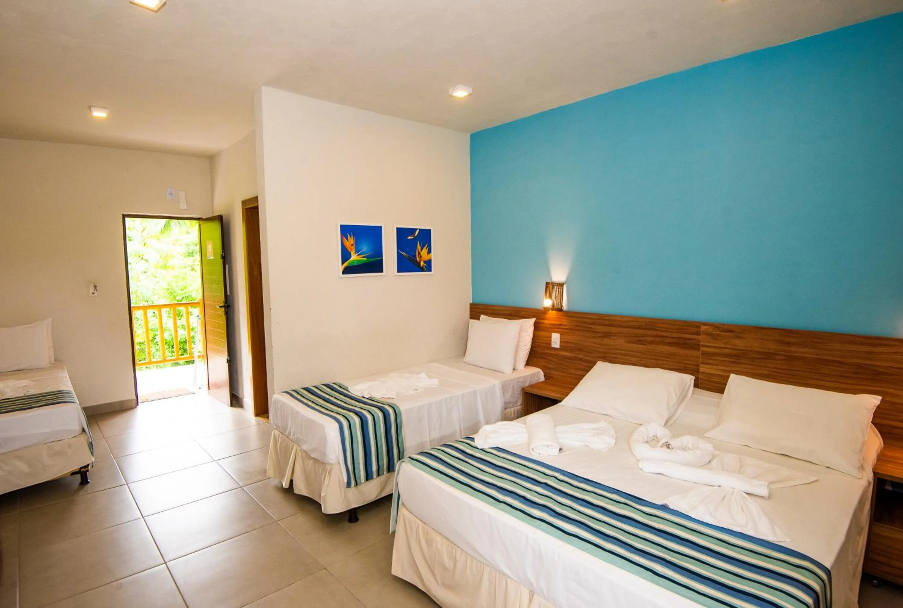 Bed in Pousada Tropicarim