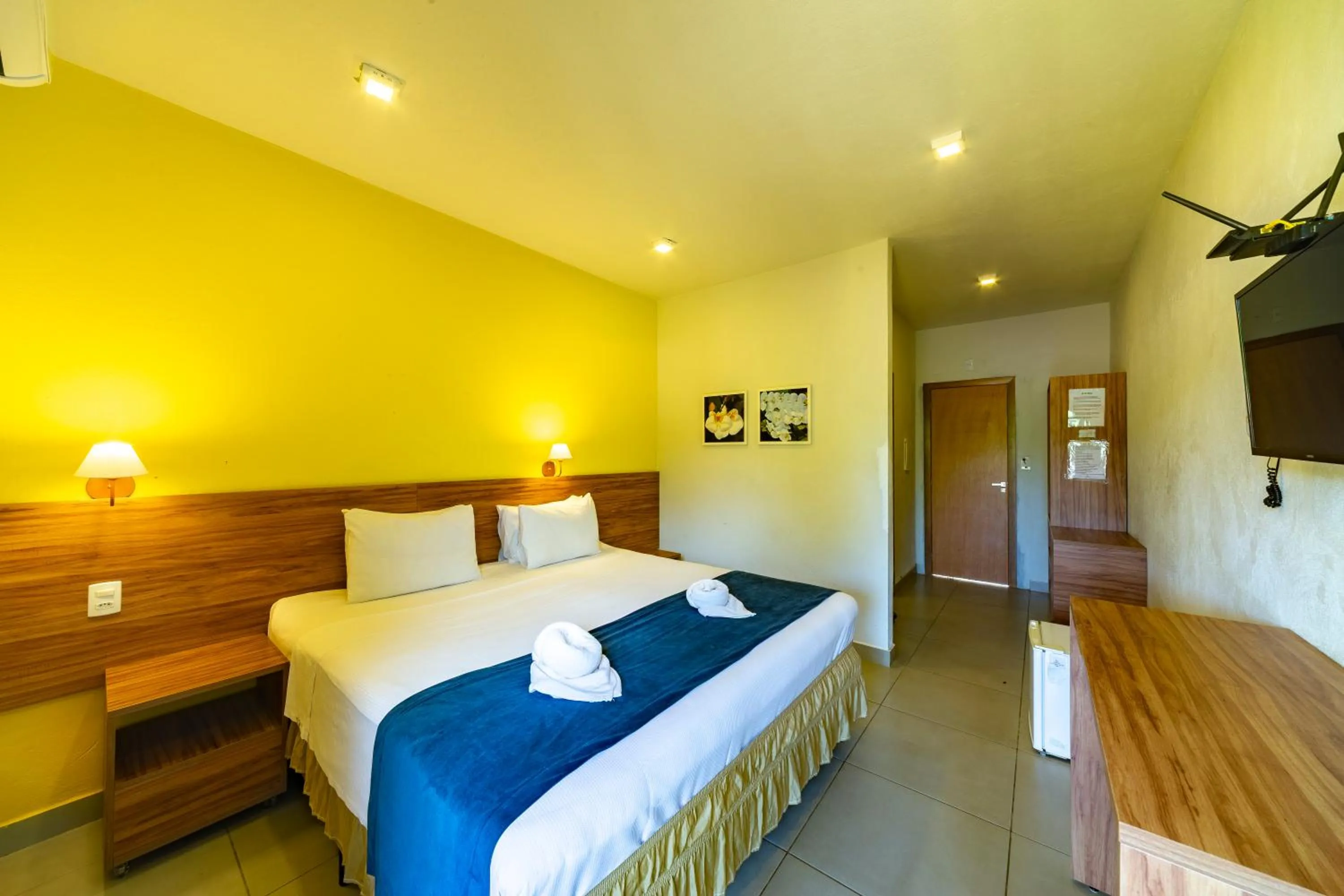 Bed in Pousada Tropicarim