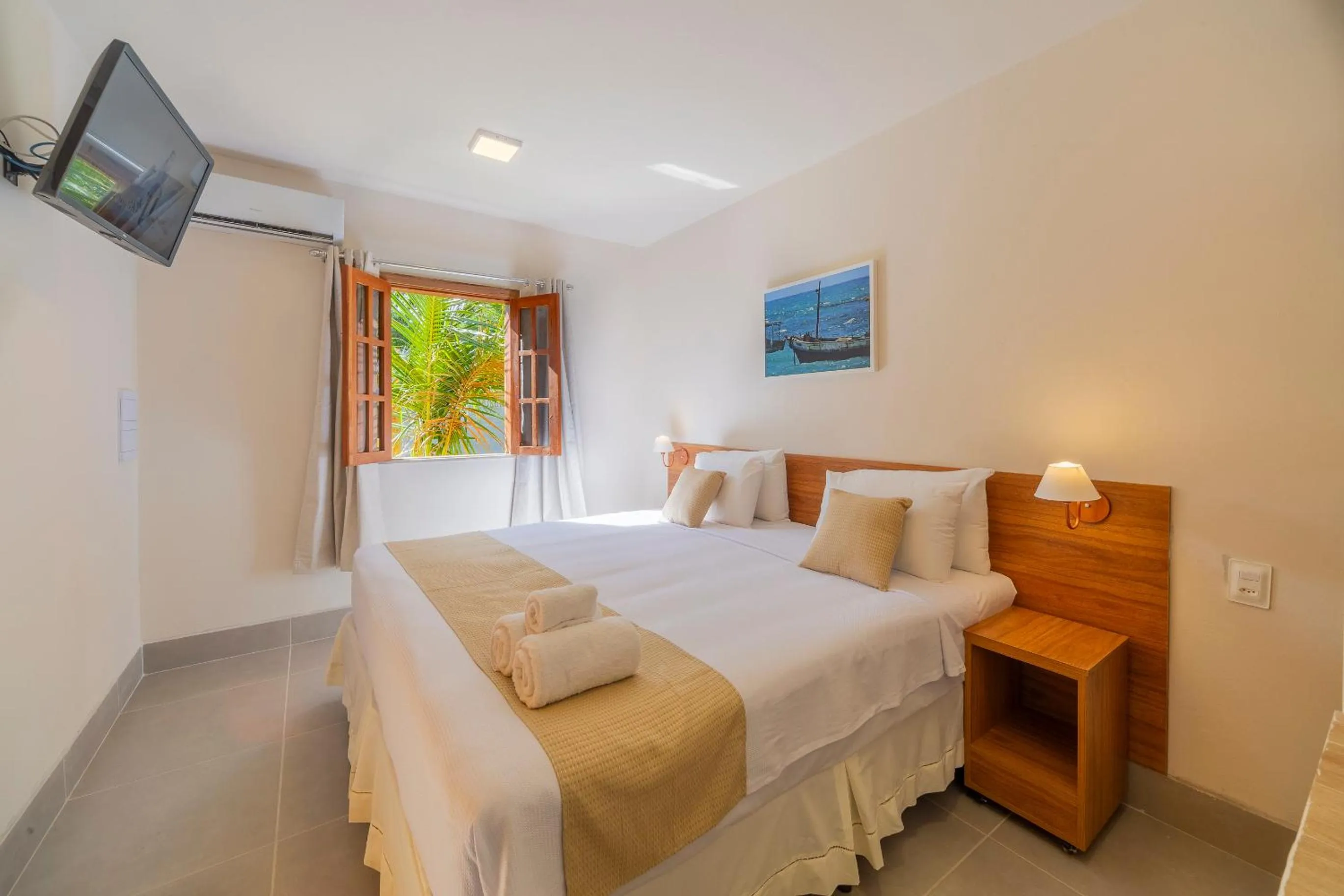 Bed in Pousada Tropicarim