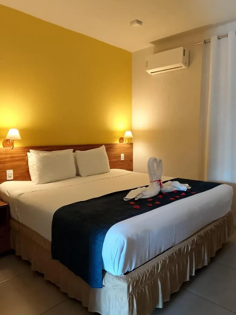 Bed in Pousada Tropicarim