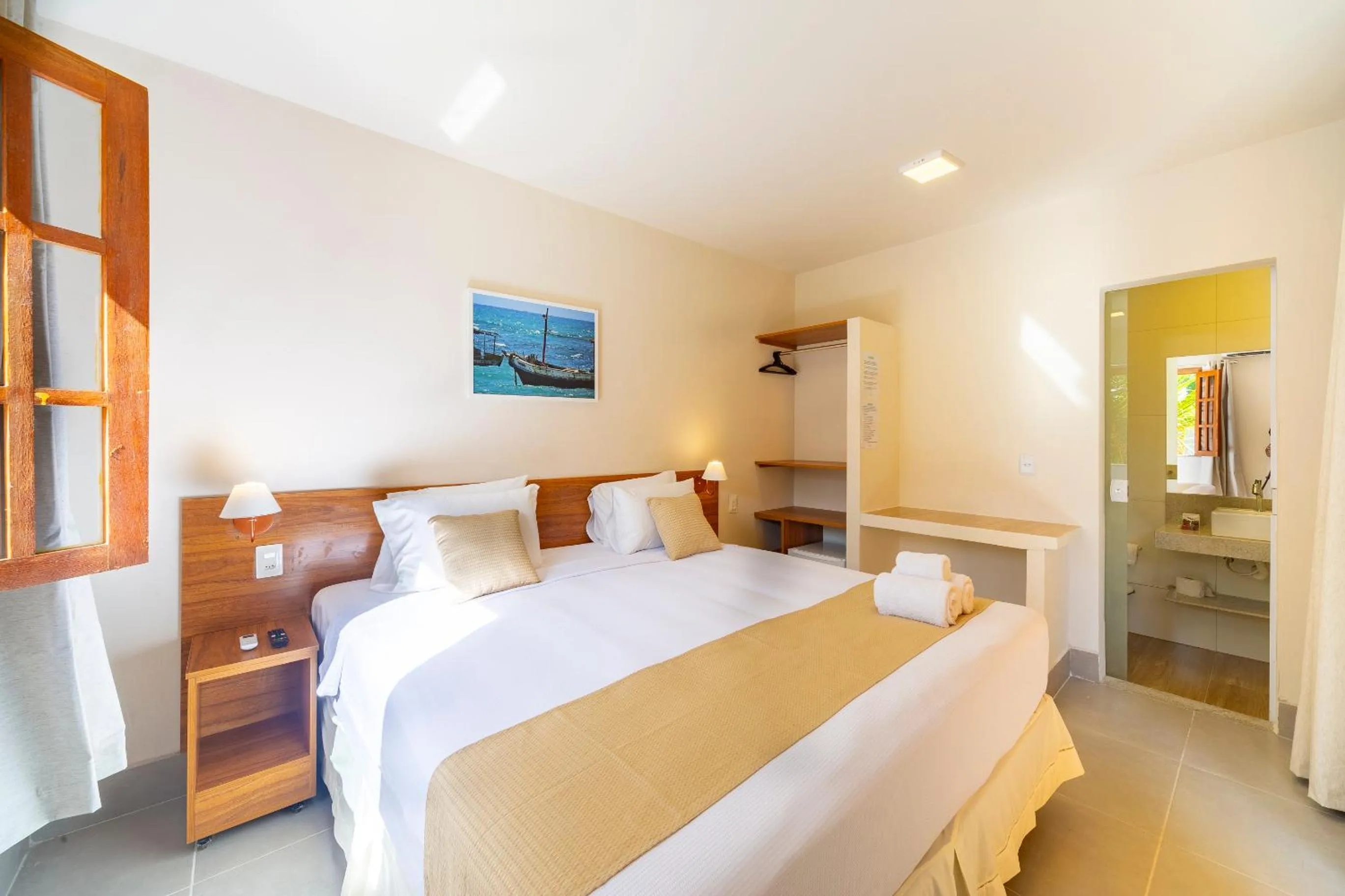 Bed in Pousada Tropicarim