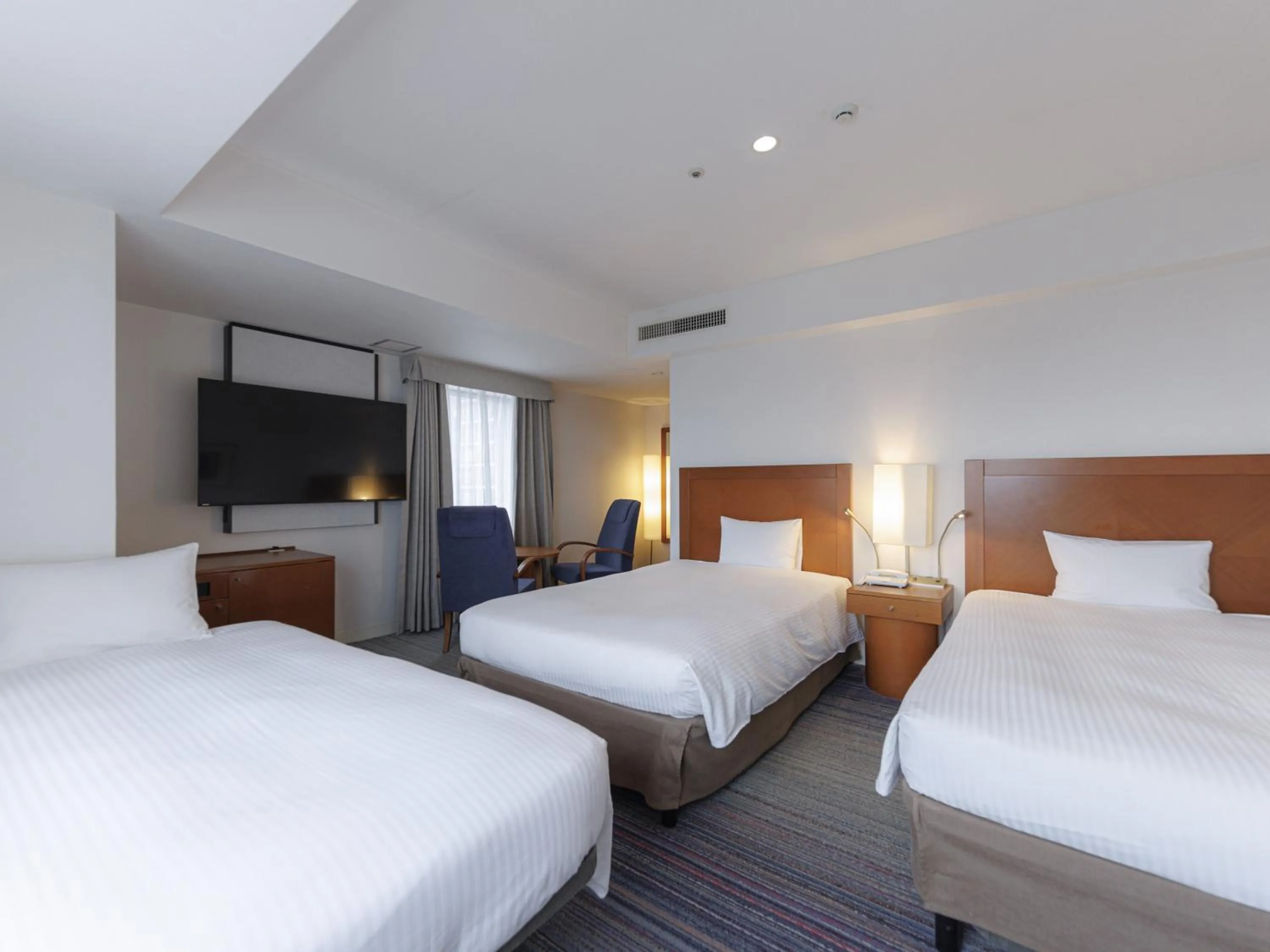 Bed in JR Kyushu Station Hotel Kokura