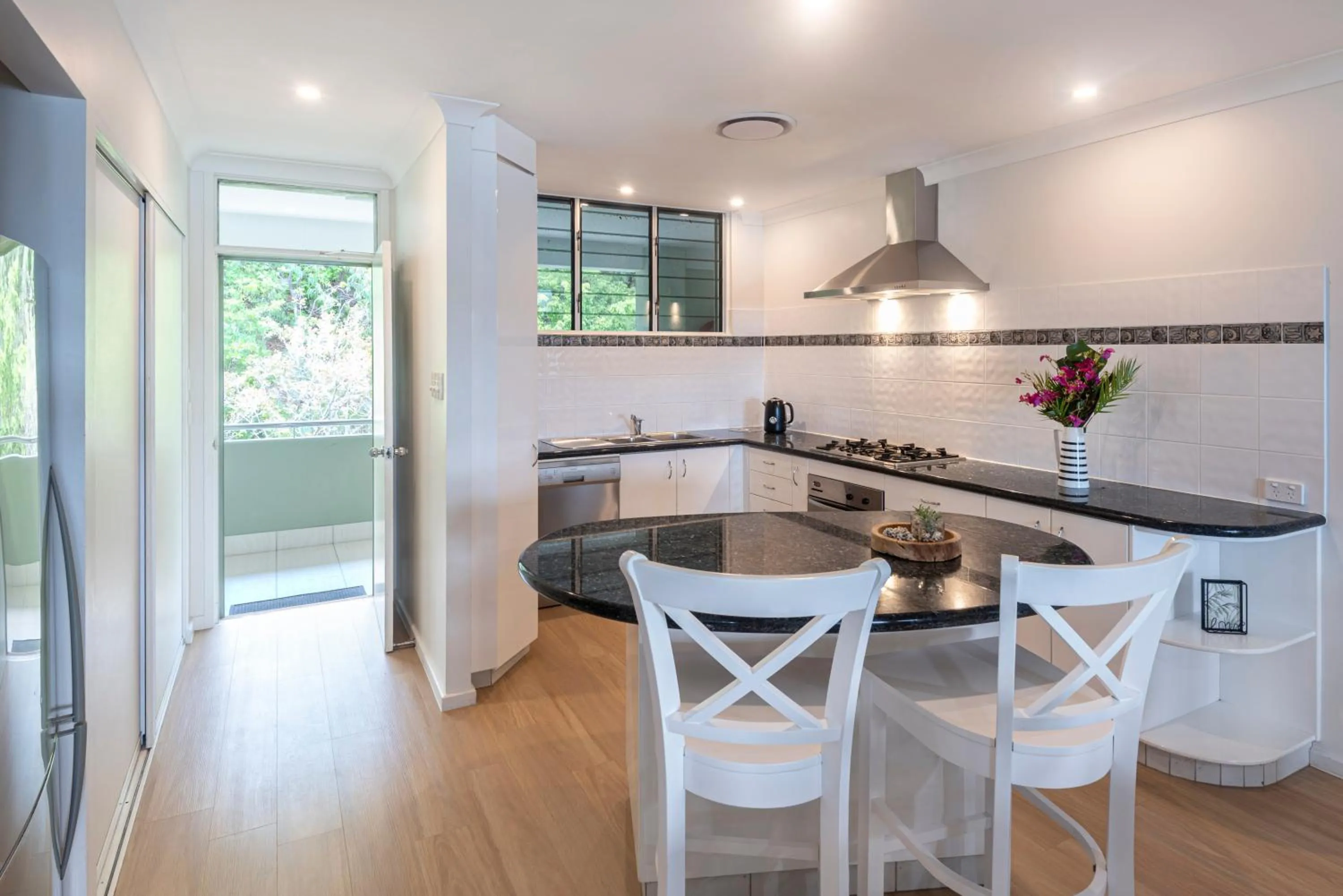 Dining area in Lagoon Beachfront Lodge 202 on Hamilton Island by HamoRent