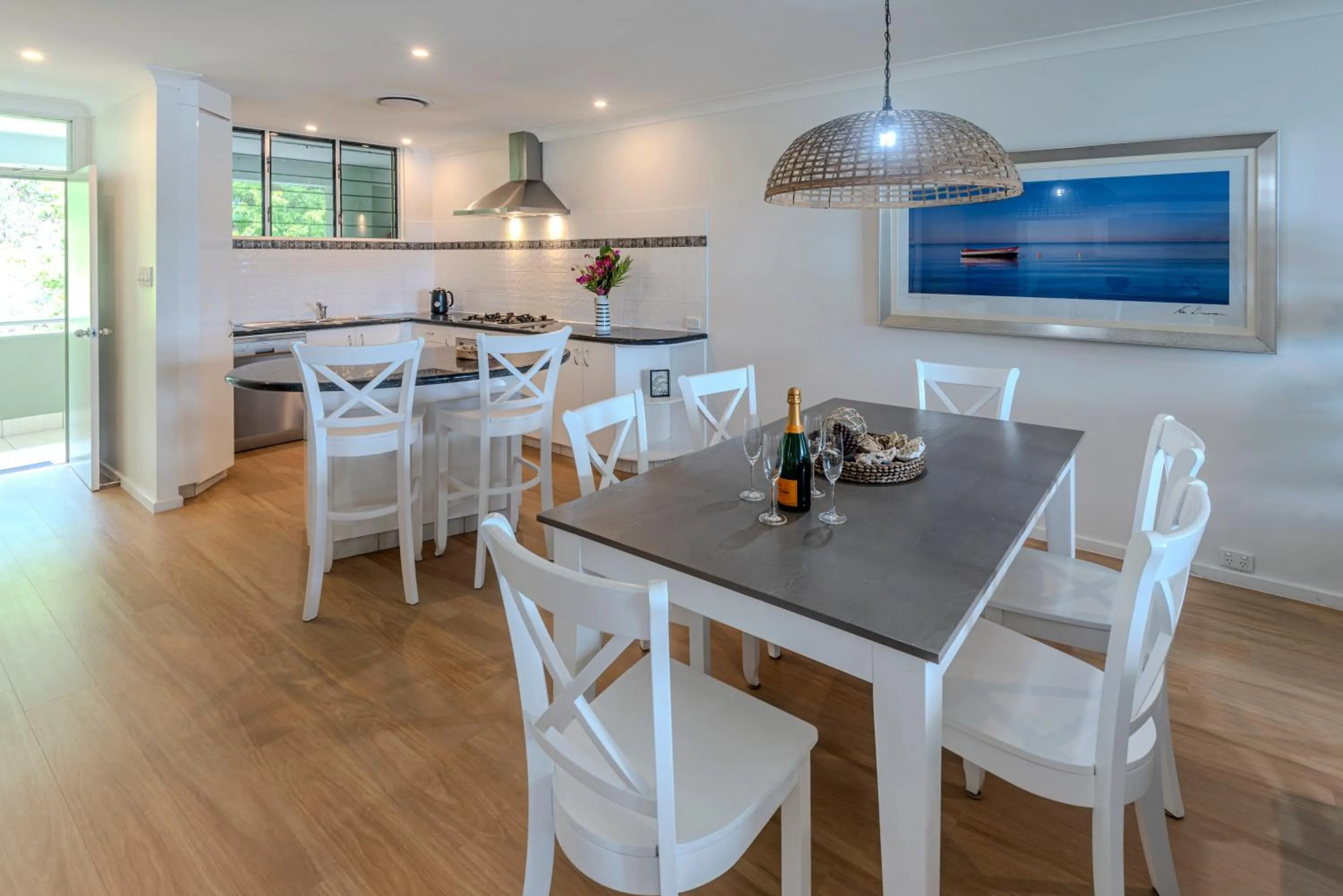 Seating area in Lagoon Beachfront Lodge 202 on Hamilton Island by HamoRent