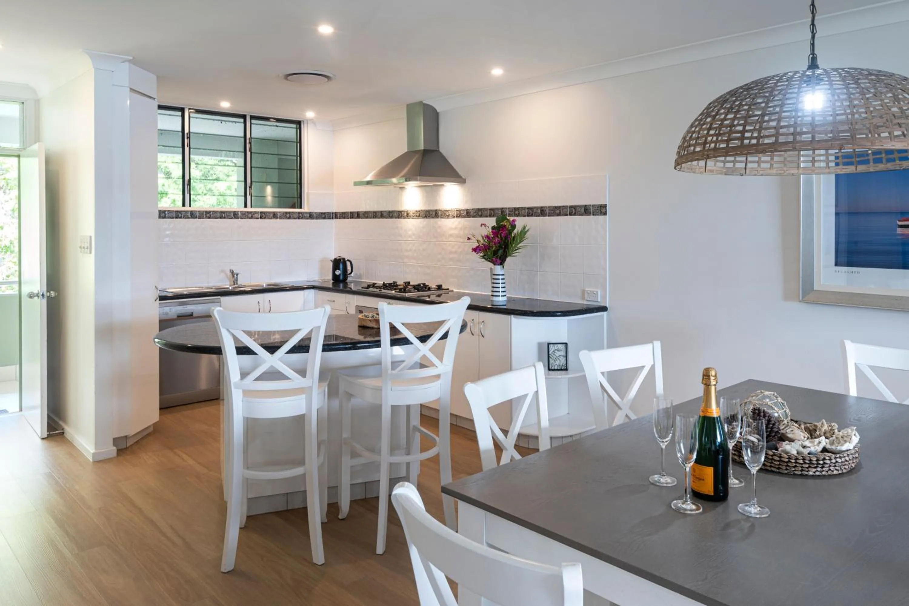 Kitchen or kitchenette in Lagoon Beachfront Lodge 202 on Hamilton Island by HamoRent